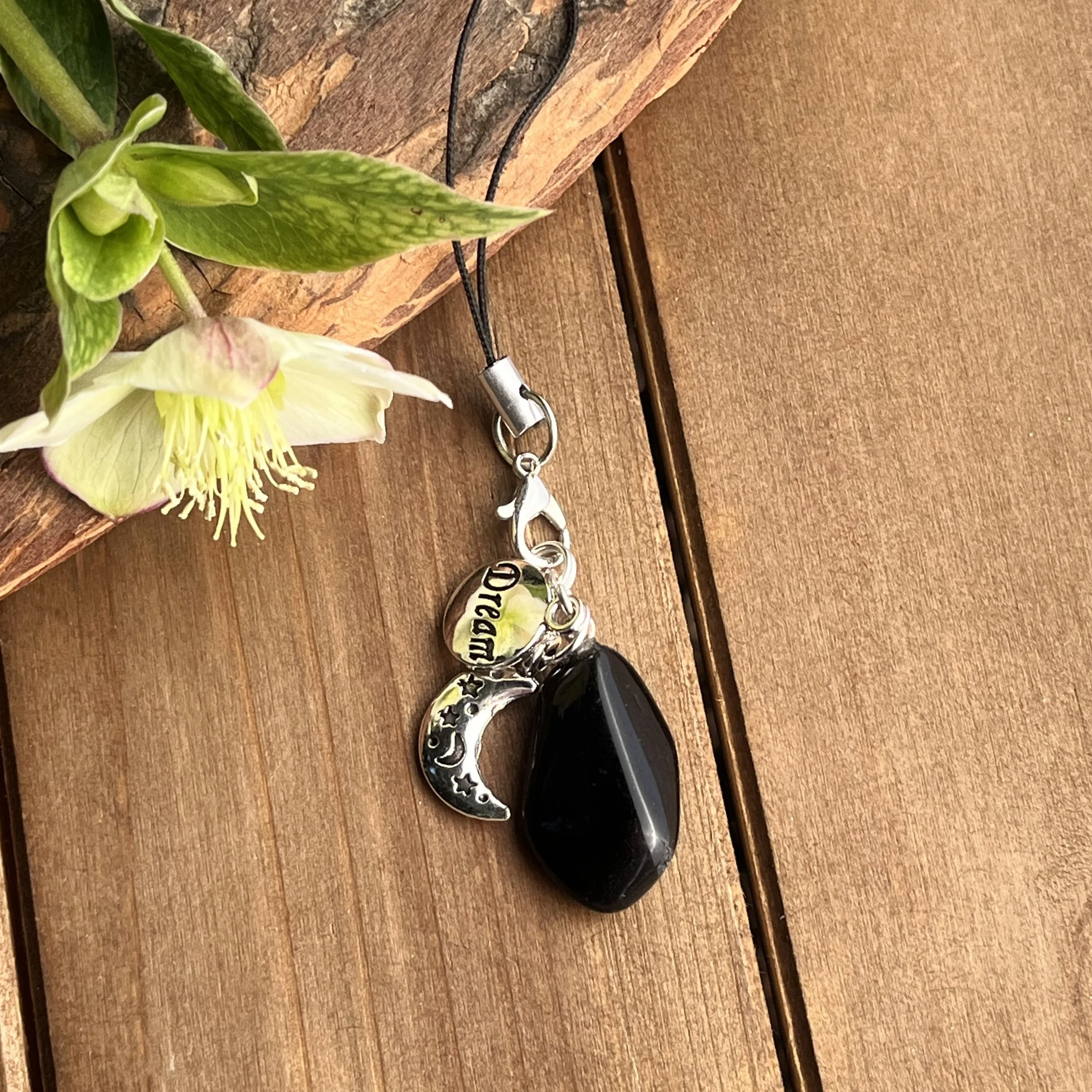 obsidian charm with moon
