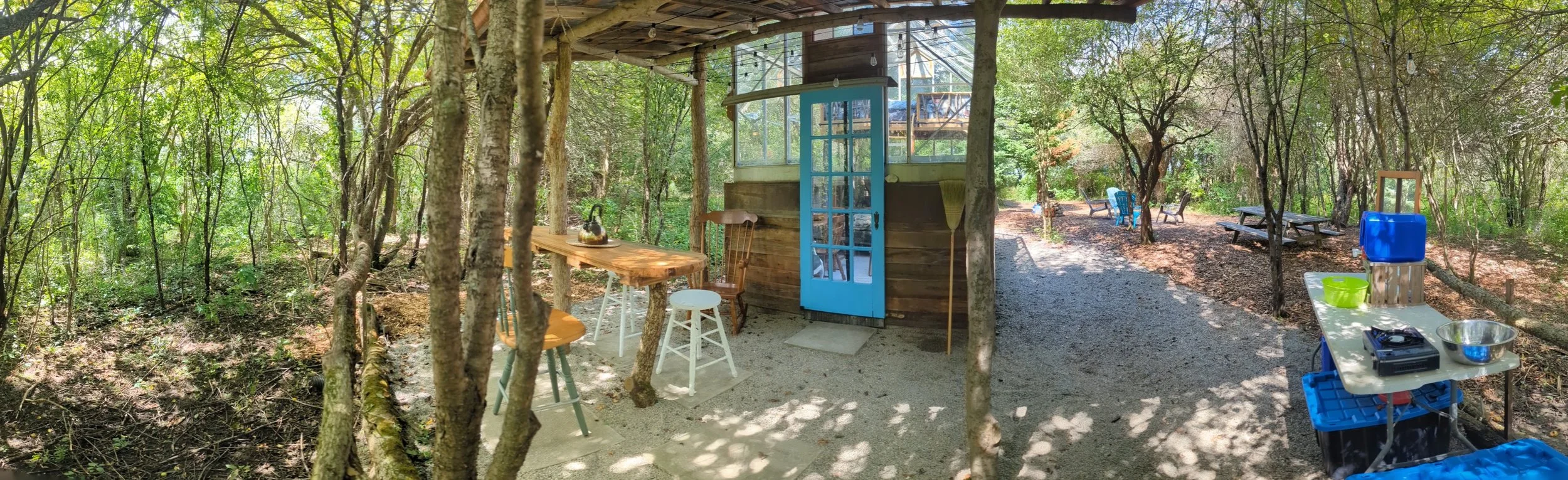 Glass greenhouse farmstay at Mulberry Moon Farm near Strathroy Ontario, off-grid glamping under the stars