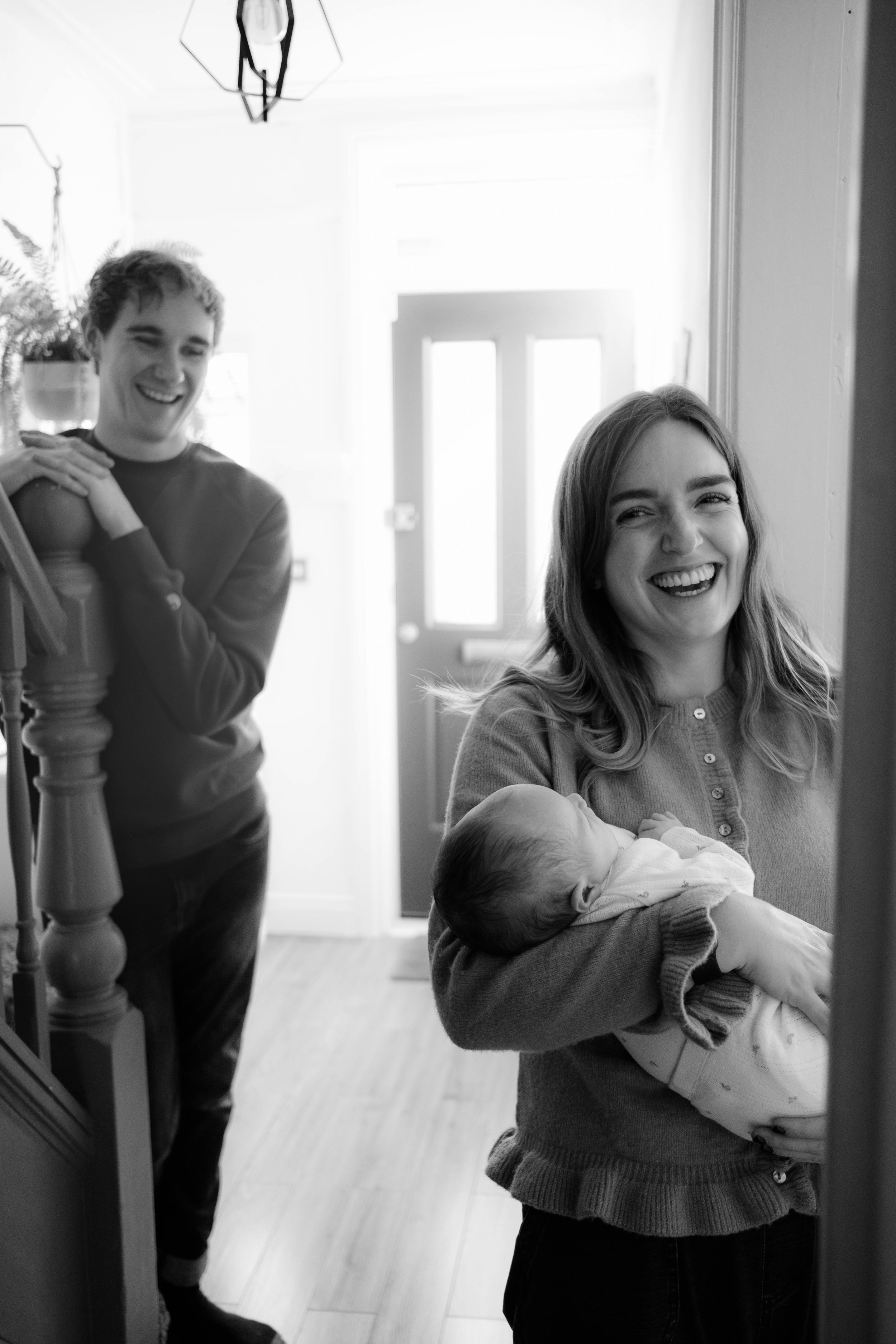 New parents with their newborn baby — black and white family photography, Liverpool