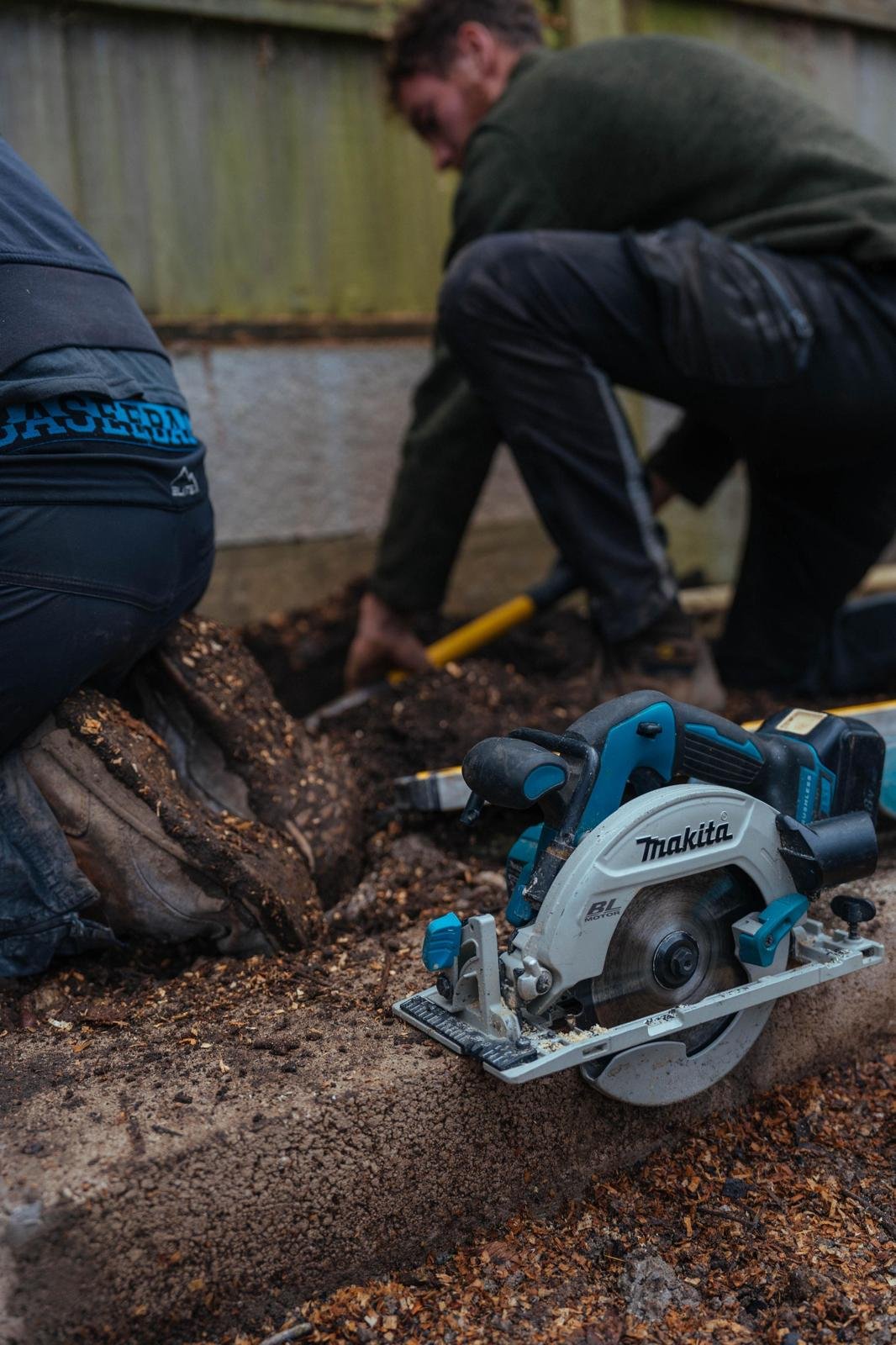 Person working with a circular saw — documentary and commercial photography