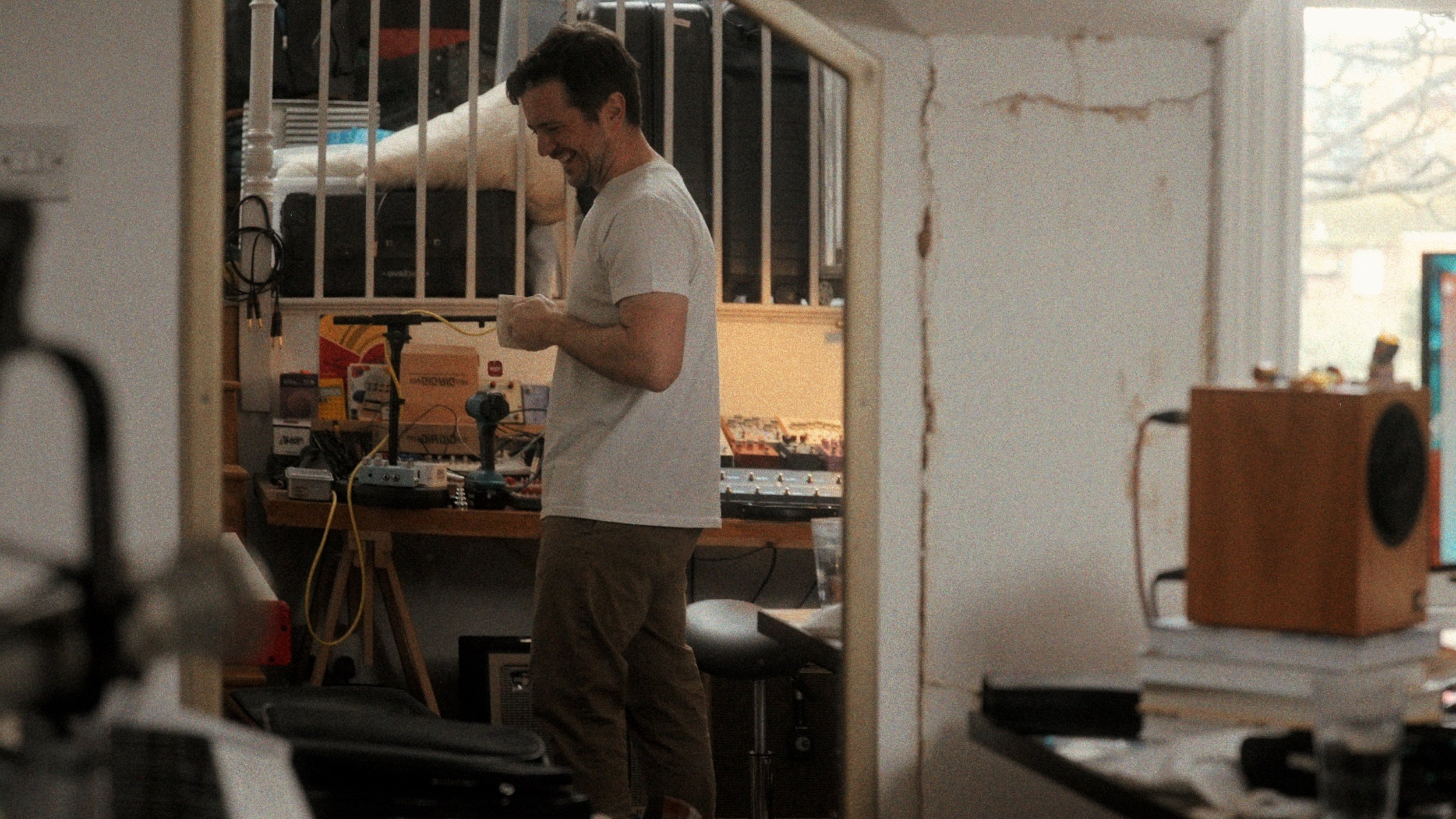 Creative professional in their home studio surrounded by photography equipment
