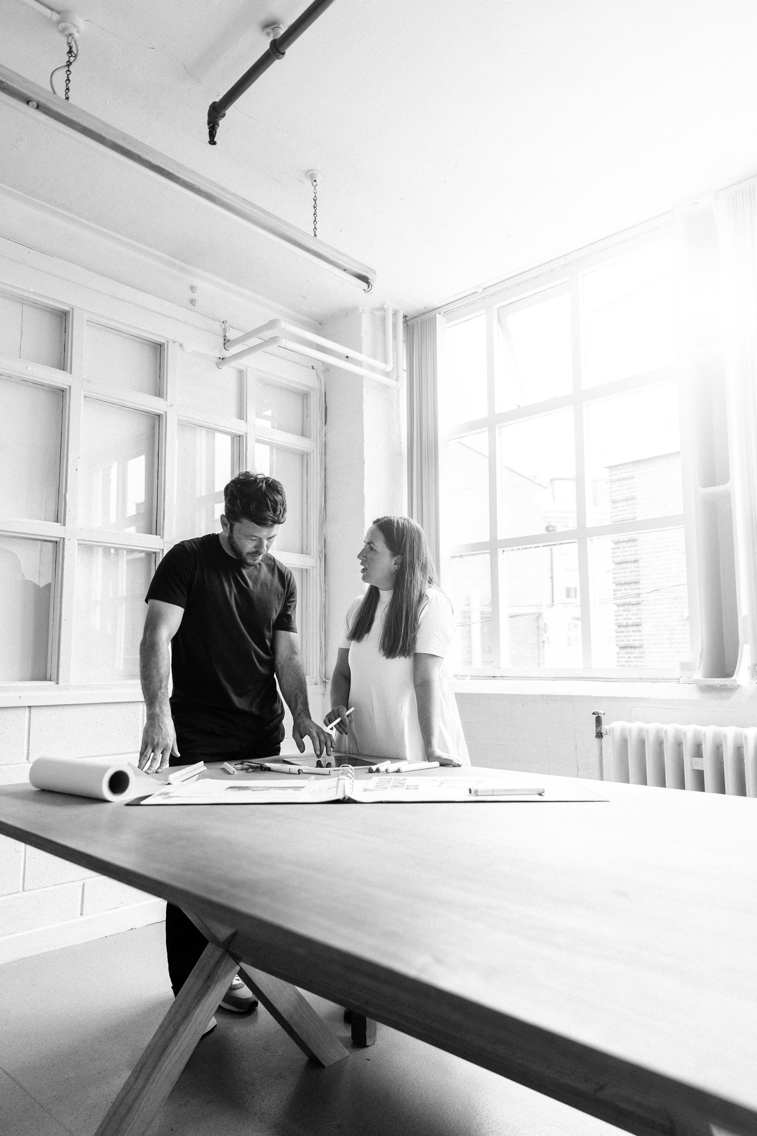 Creative photography session — two people in a bright studio workspace, Liverpool