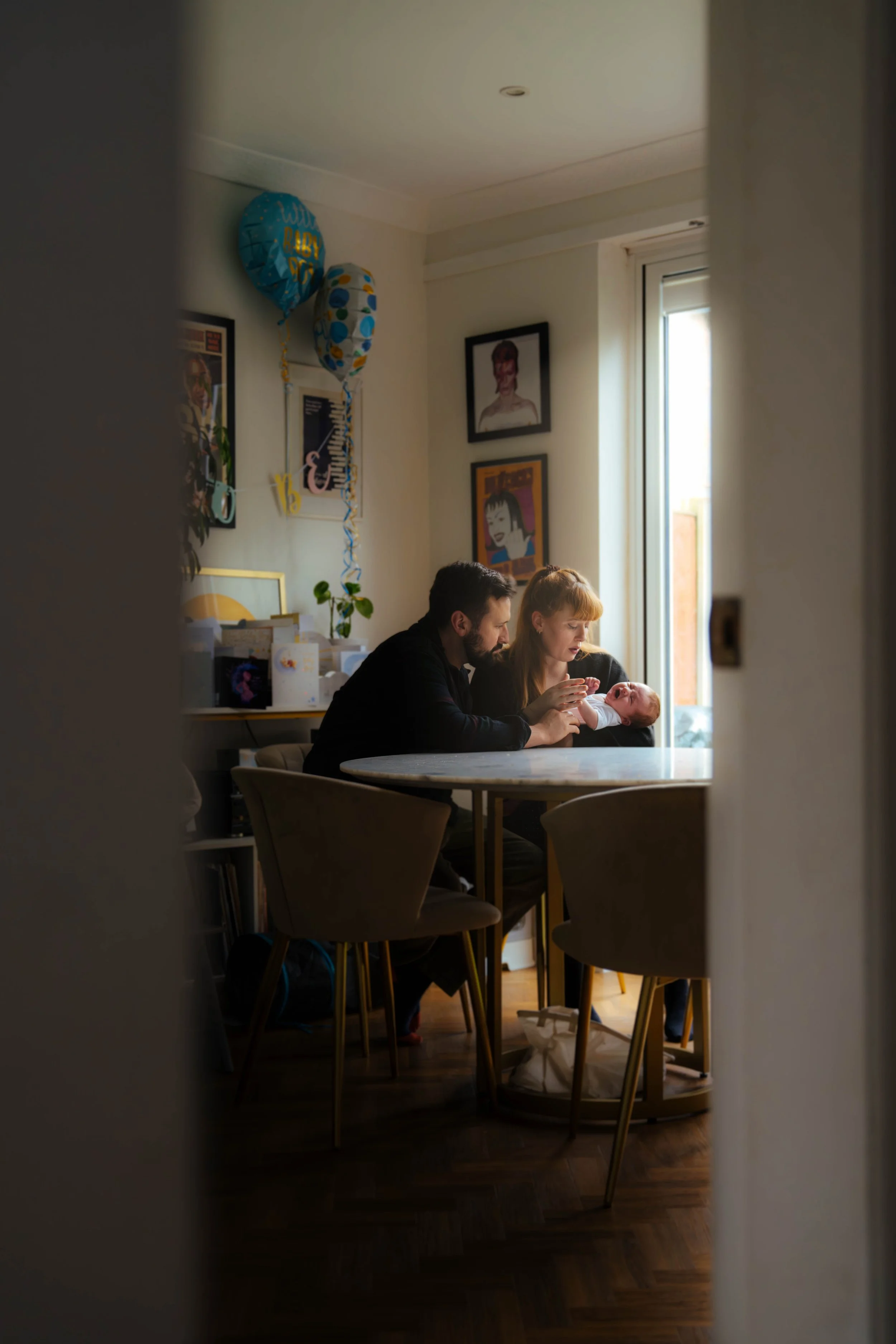 Person working at a desk in a cosy home interior — documentary lifestyle photography