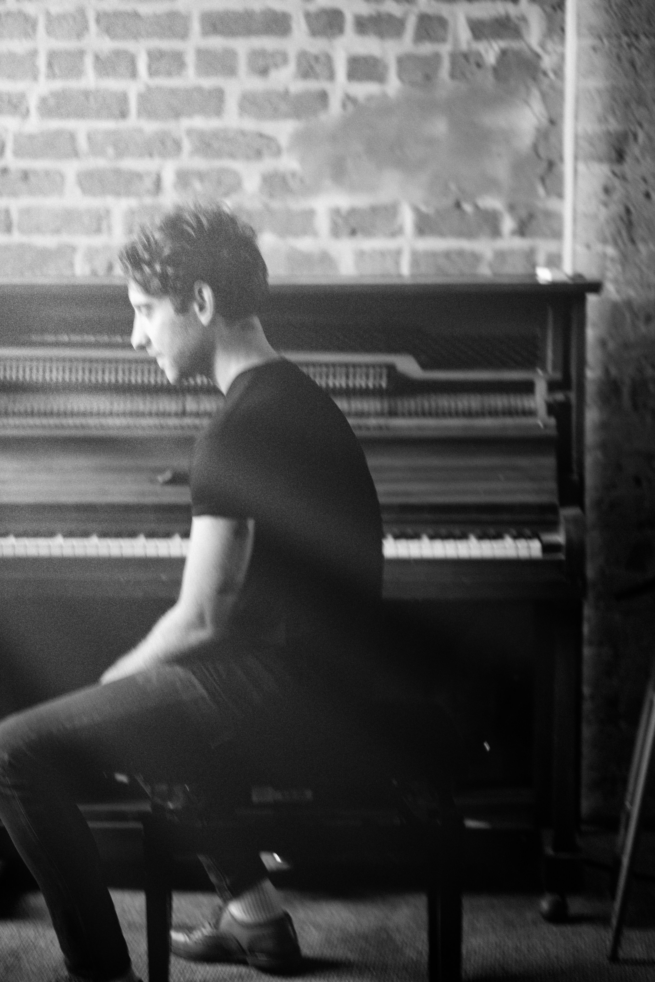 Pianist portrait in profile — black and white music photography
