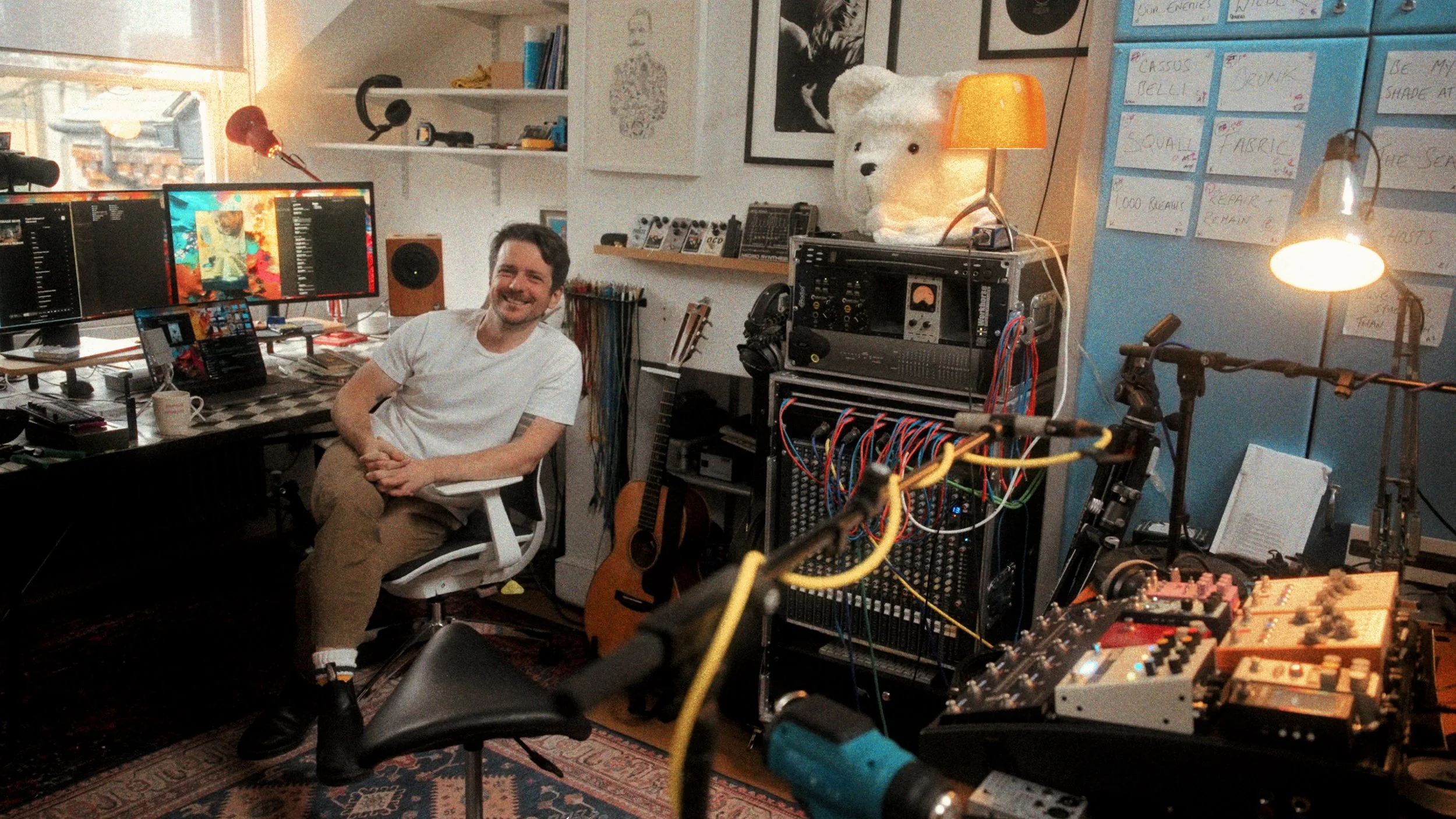 Home recording studio with vintage equipment and teddy bear mascot — creative workspace photography
