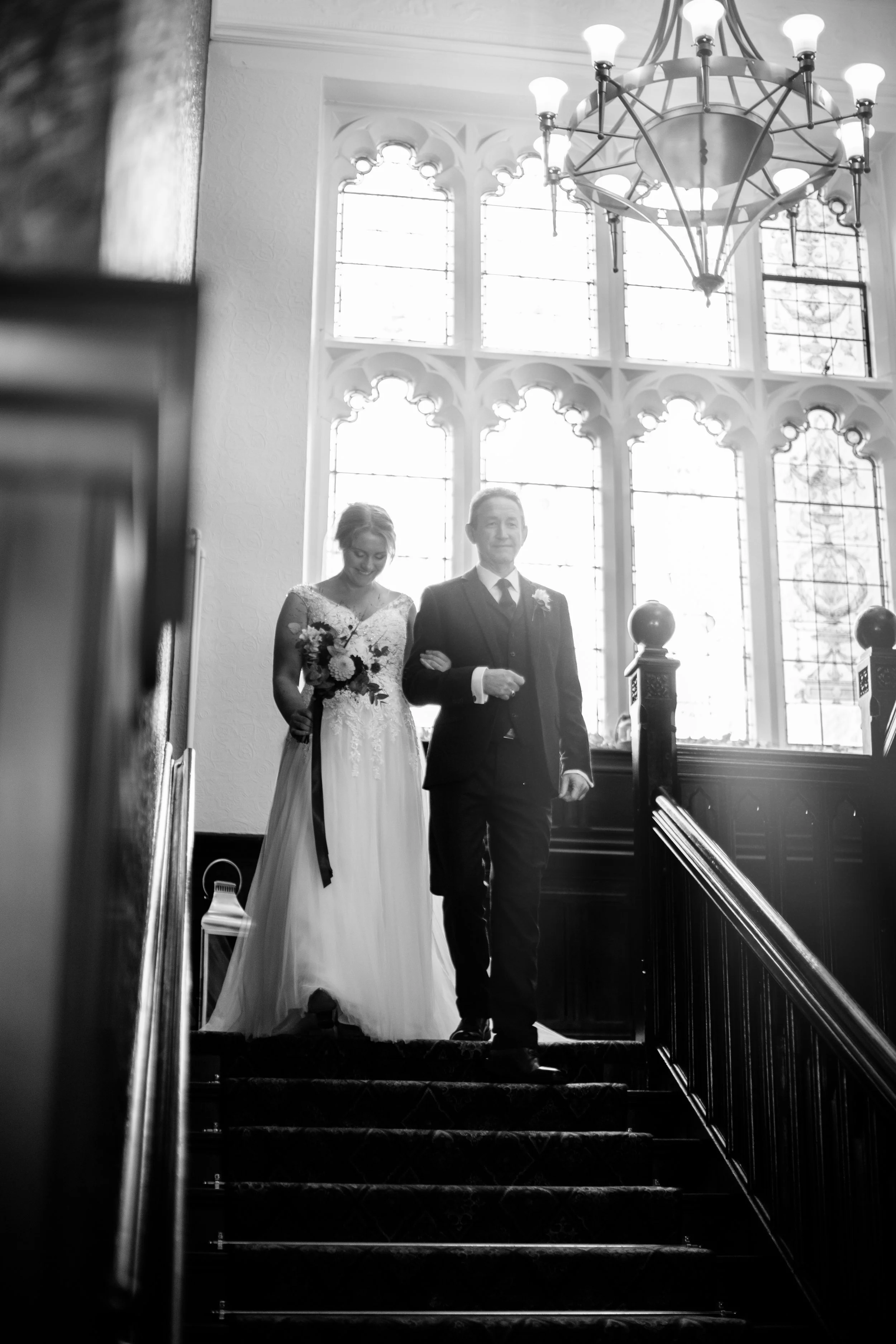 Wedding ceremony on church staircase — bride and groom, black and white wedding photography