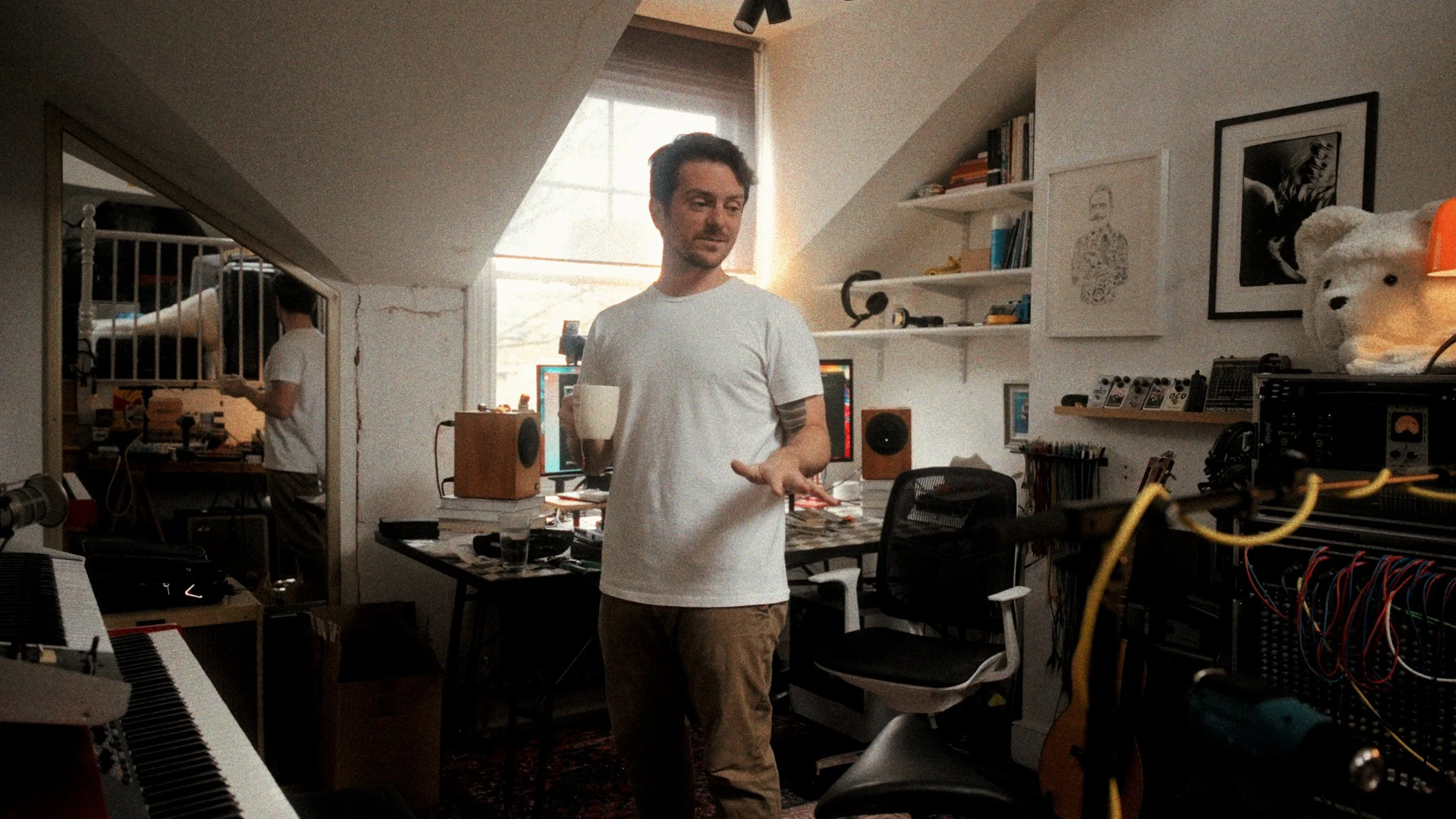 Creative director at their home studio workstation — professional workspace photography