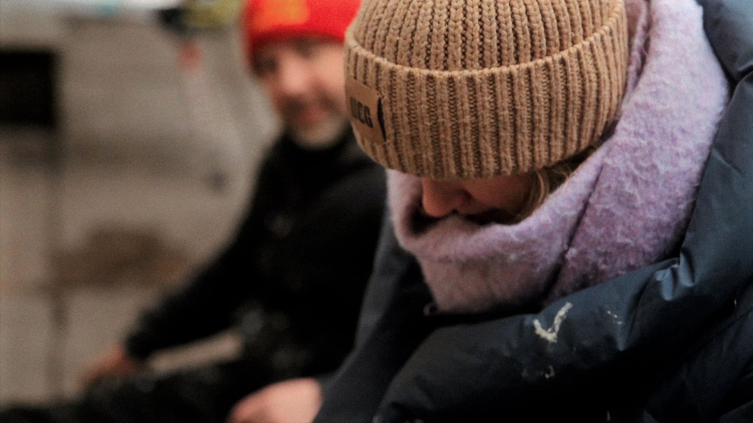 Candid street portrait — person in knitted beanie hat, documentary photography Liverpool