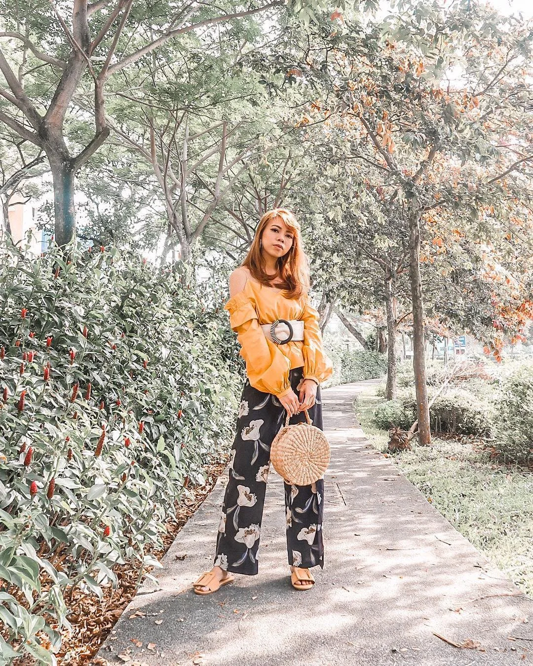 Give your tropical-print palazzo a feminine touch and style it with a cold-shoulder blouse like @masturahkay