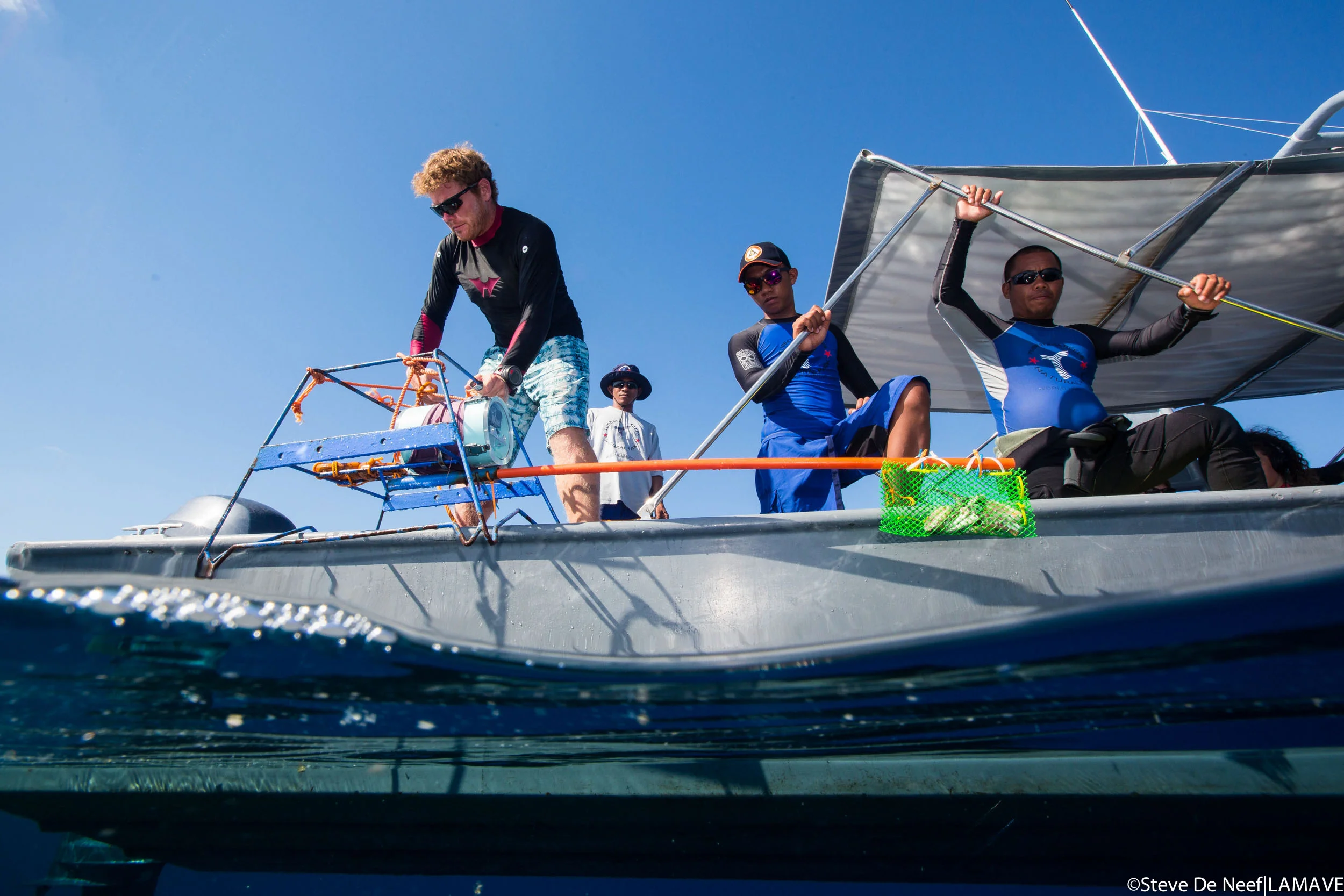 LAMAVE researcher Ryan Murray deploying a BRUV System with the Tubbataha Reefs Natural Park Rangers.