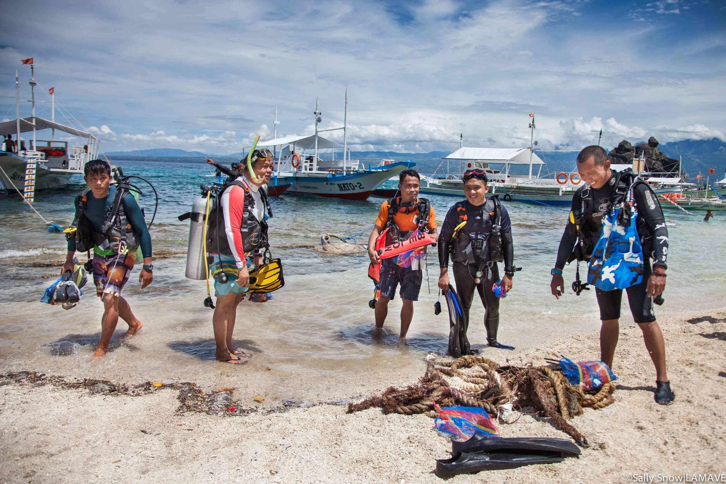 Divers return after a clean up