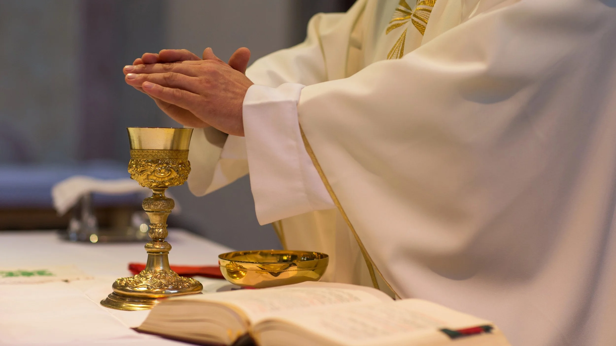 priest officiating wedding ceremony nuptual mass widescreen.jpg