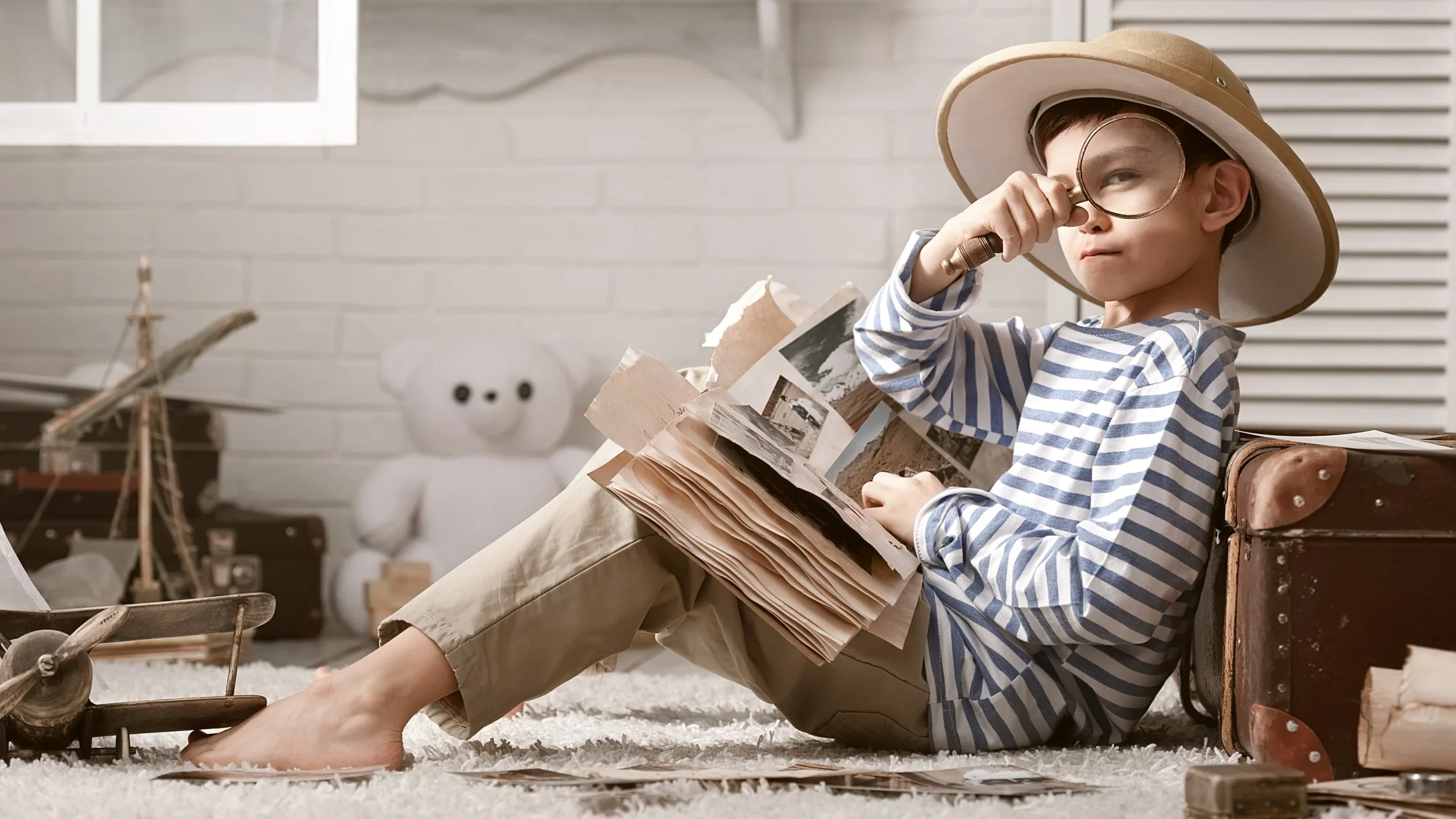 child explorer looking thru magnifying glass widescreen.jpg