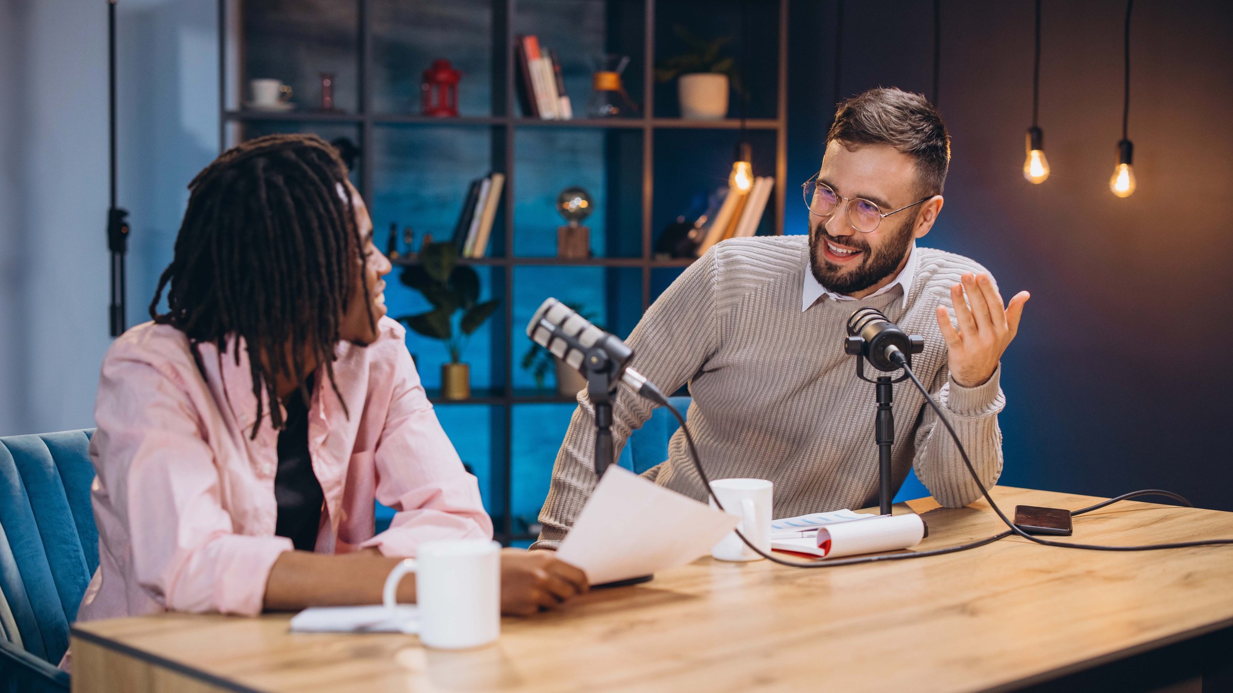 man woman diversity speaking conversation podcast microphone widescreen lowres.jpg