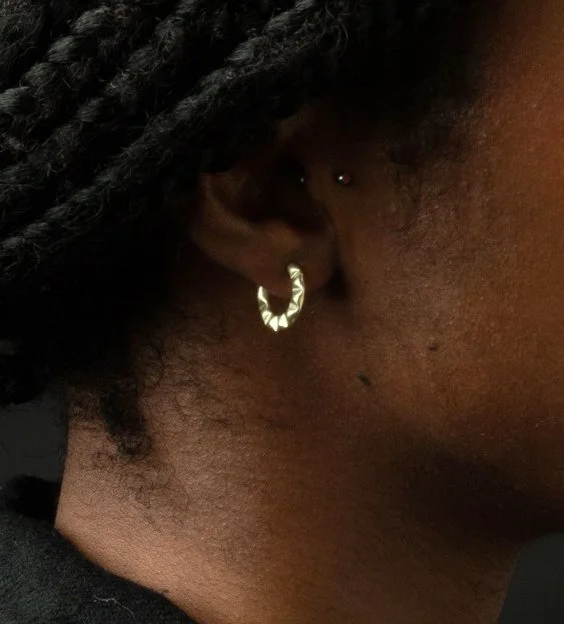 small crimped gold hoops ola close up.jpg