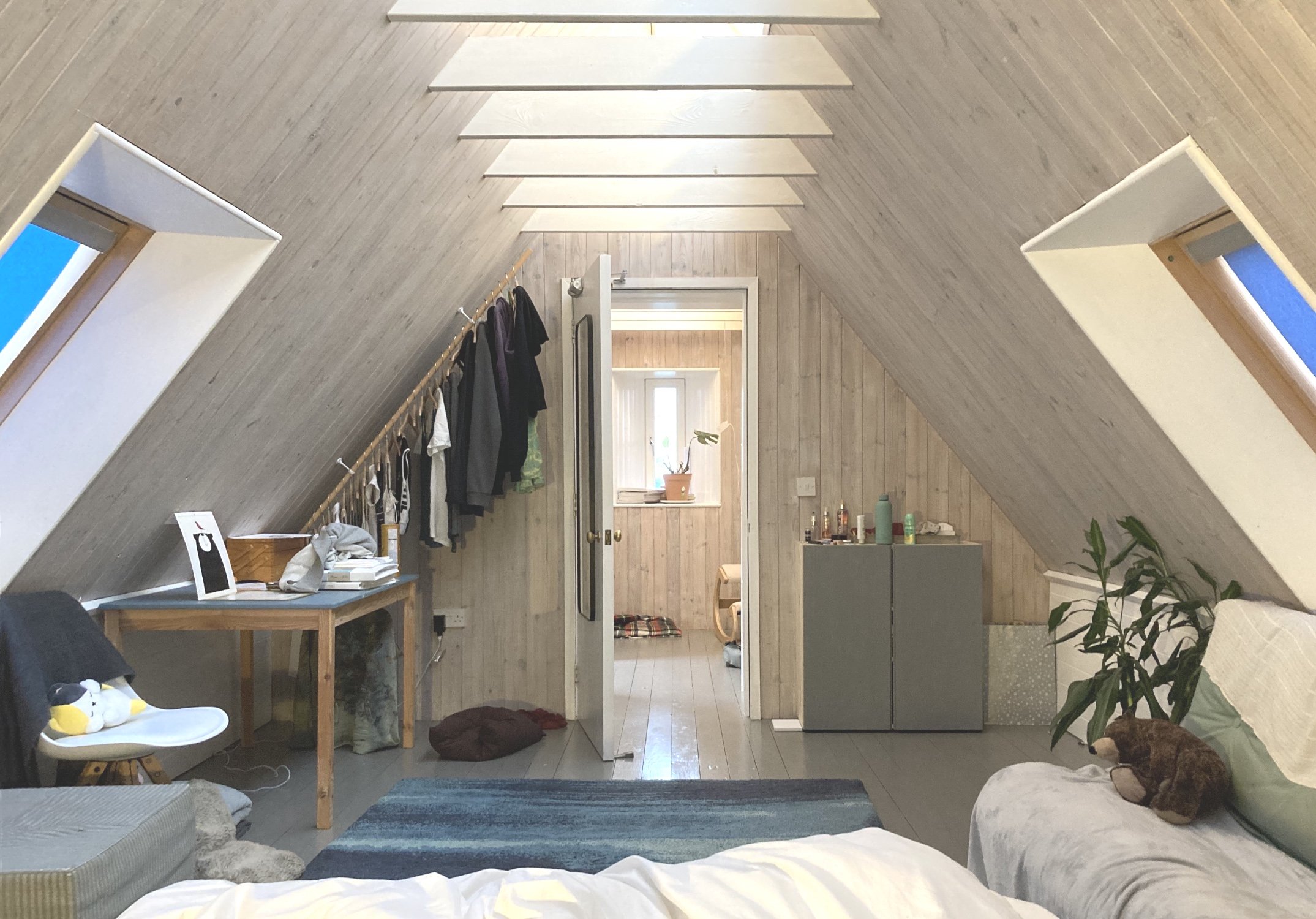 The door placed centrally to the room gives an axial view through to arrow window in gable with views to the north.
