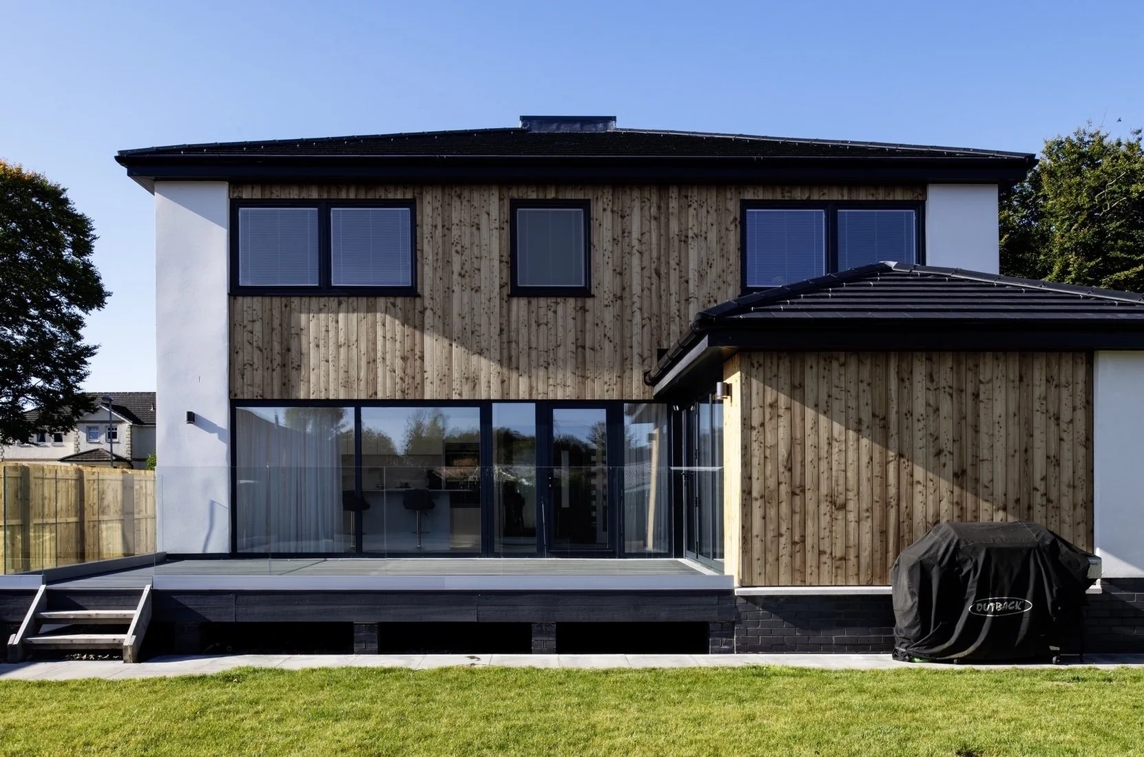 The rear elevation is more informal again, opening on to the private rear garden.