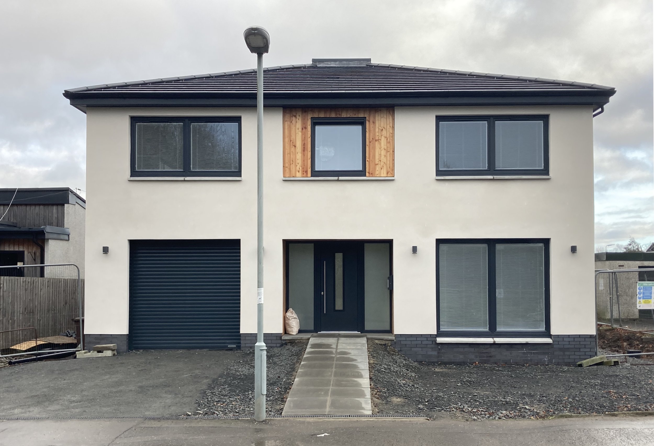 The road elevation is more formal with a traditional 3 bay arrangement.
