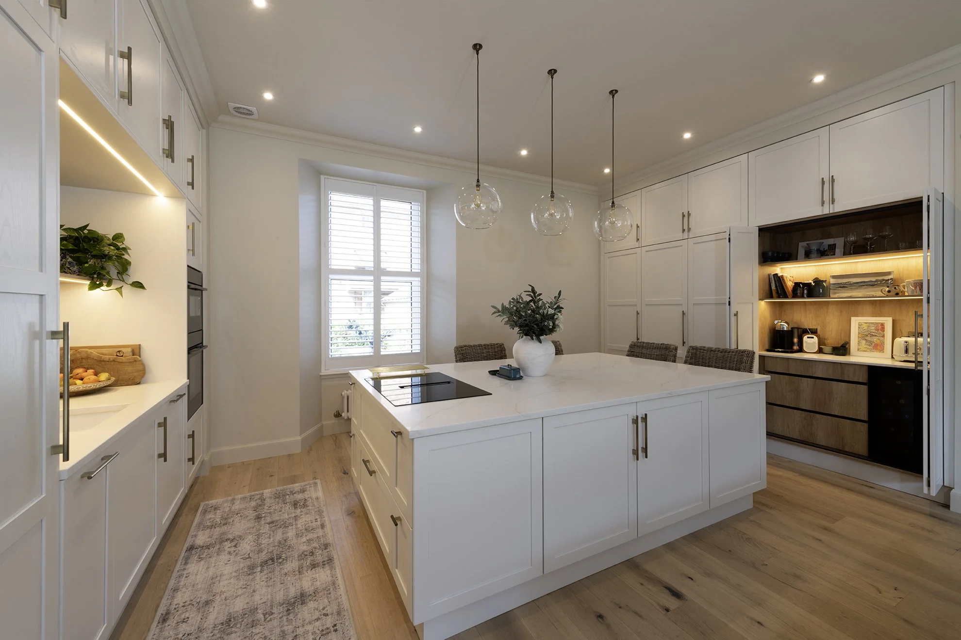 A new island unit is the focus of kitchen life, with a downdraft induction hob.