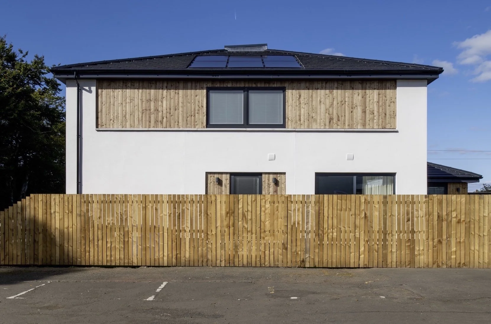 The side elevation is less formal although organised by the same geometry.