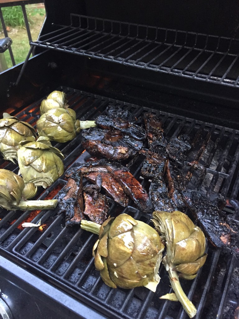steak and artichoke cooking on the grill.jpg