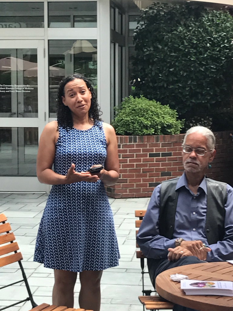 Photographer Marisol Diaz speaking on Community Enrichment Day.