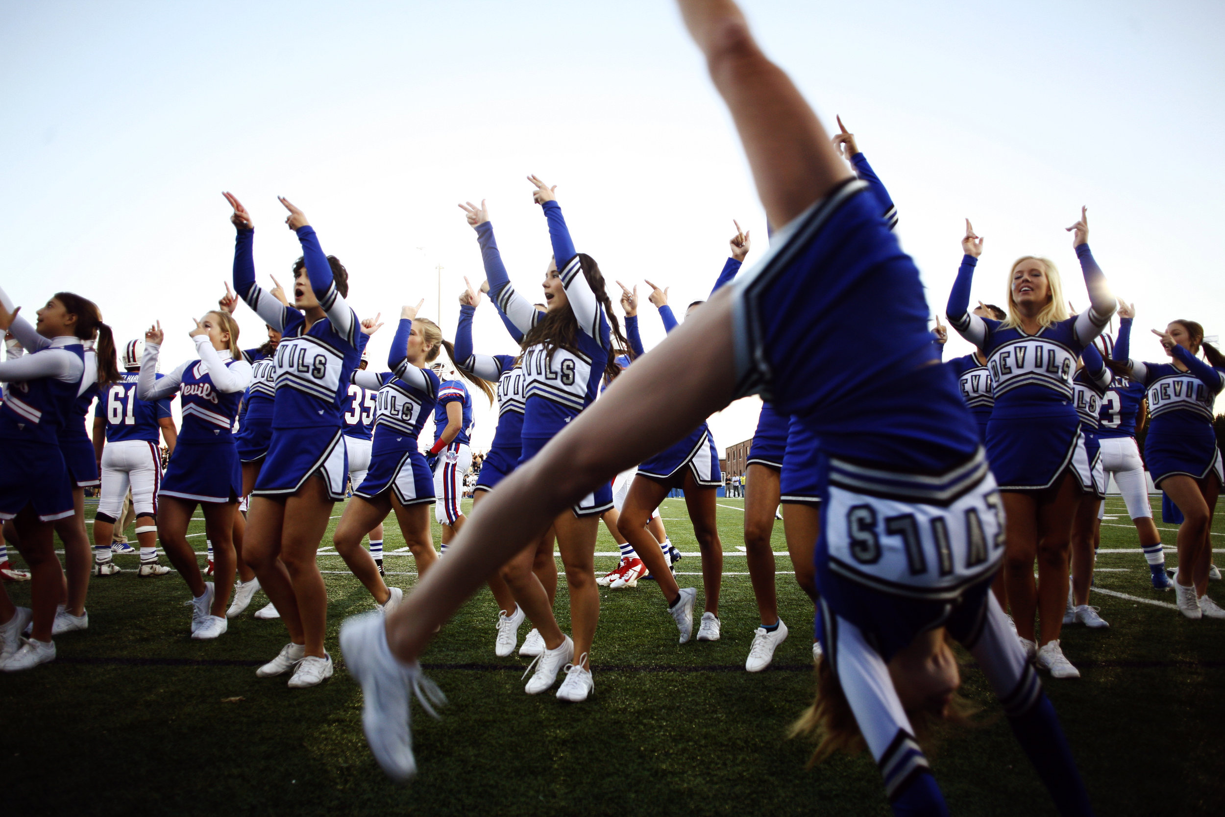 The Springfield Blue Devils cheerleaders preform on the sidelines during a football game in Holland, OH.