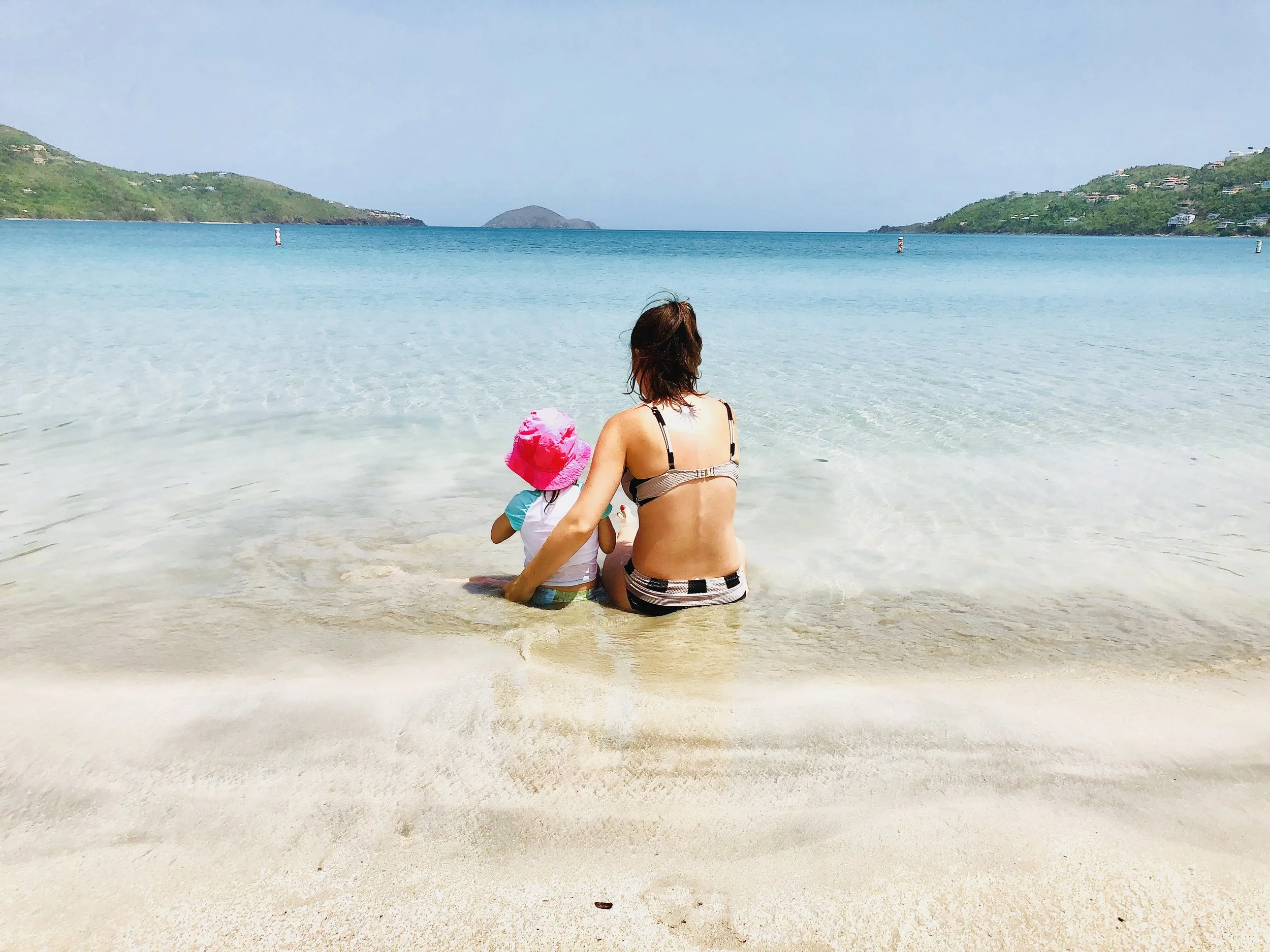 Ella and her mom relaxing in the warm Caribbean Sea.