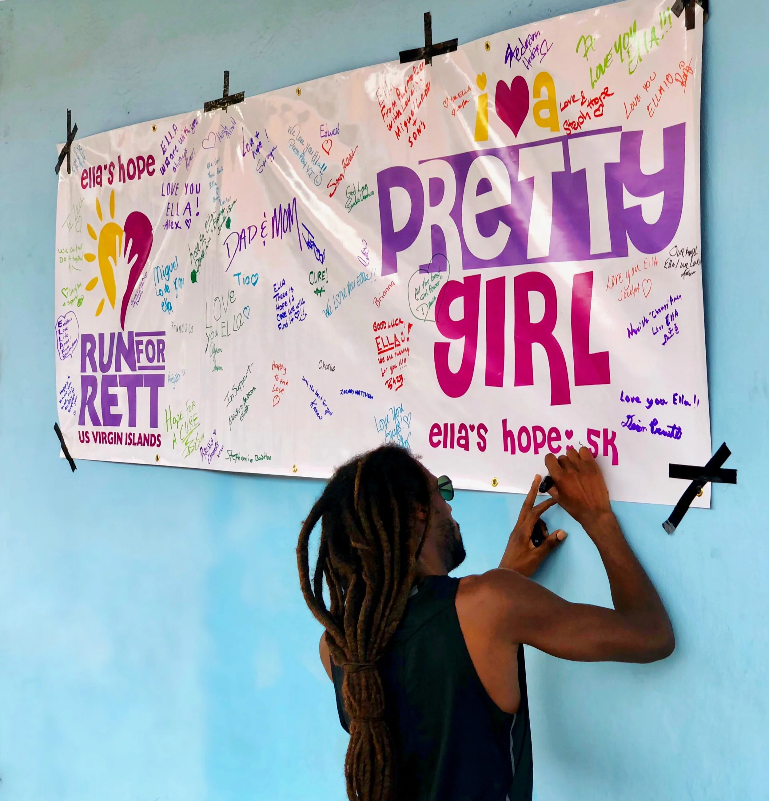 Ella’s Hope 5K winner, Shane DeGanes signs the Hope banner.