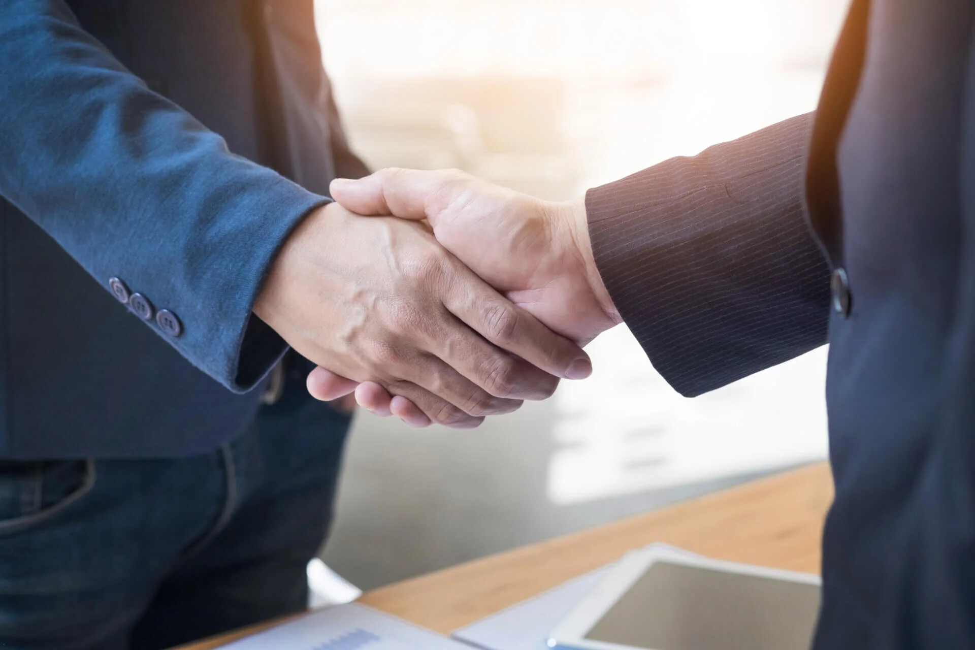 two-confident-business-man-shaking-hands-during-meeting-in-the-office-success-dealing-greeting-and-partner-concept.jpg