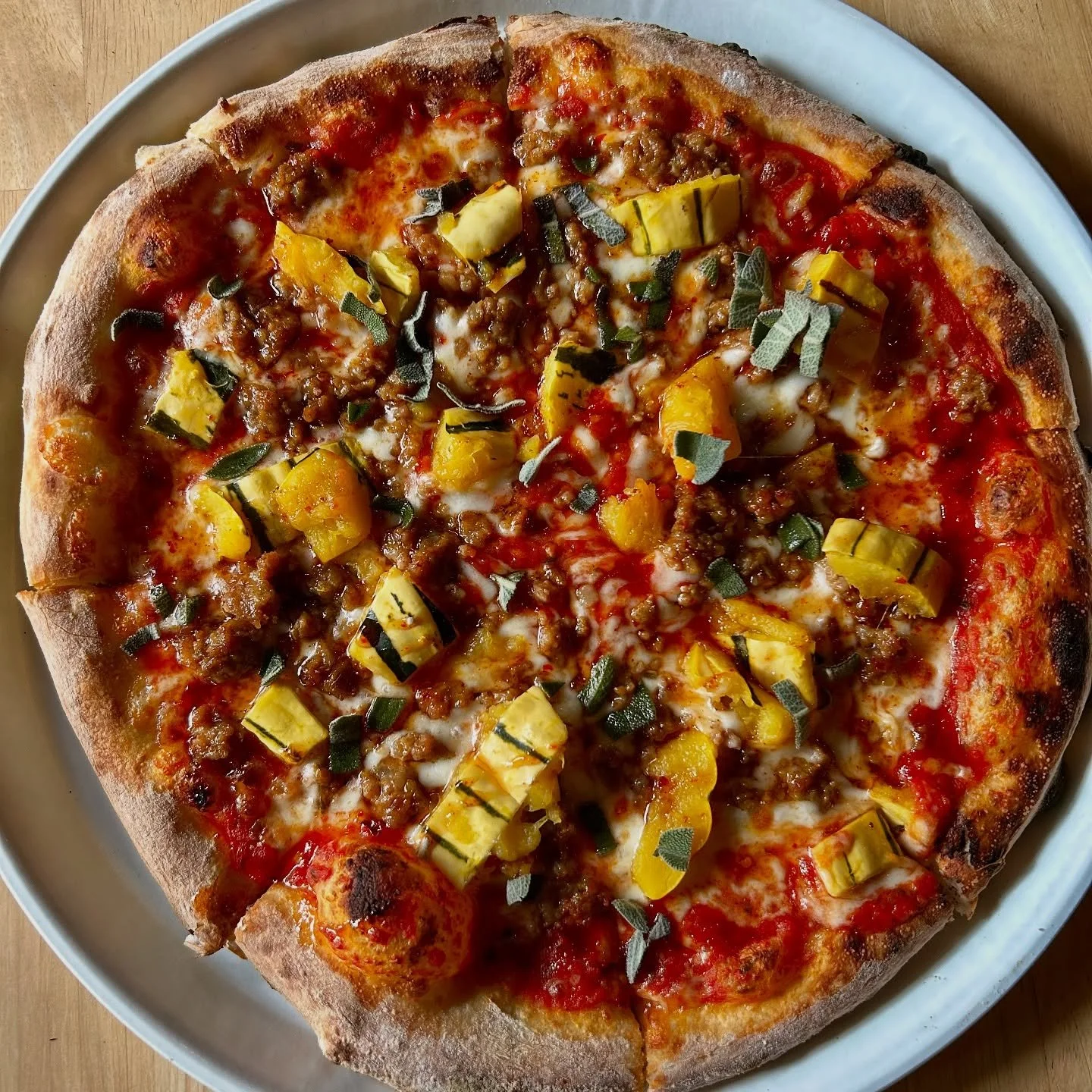 The October Pizza Special is now available!  The Delicata Squash and Sausage Pizza features our housemade sourdough crust topped with red sauce, delicate squash, Italian sausage, mozzarella blend baked to perfection in our wood-fired oven and then is