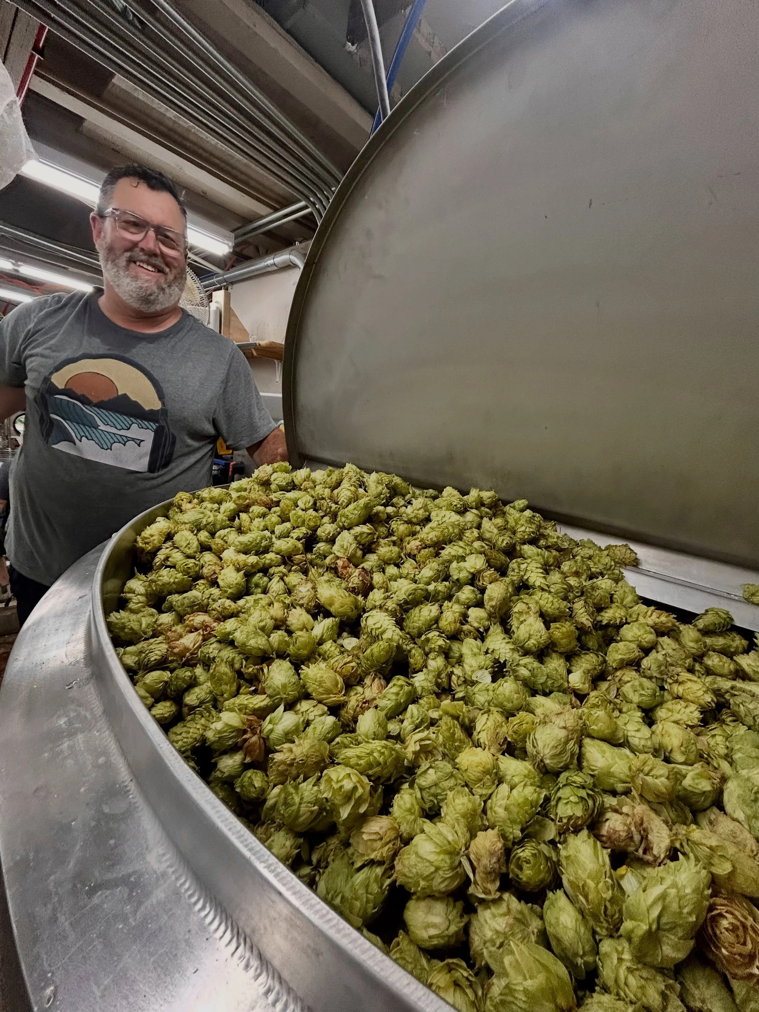 Bright and early on Tuesday morning Mike made the trek to McKay Farms in St. Paul to pick up fresh from the farm hops.  He hustled back to the coast to deliver these bright green beauties to brewer Matt who was ready to start the brew day back at Bea