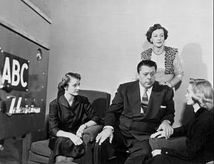 Ern with his "Girl Friday", Betty Westmore (standing).