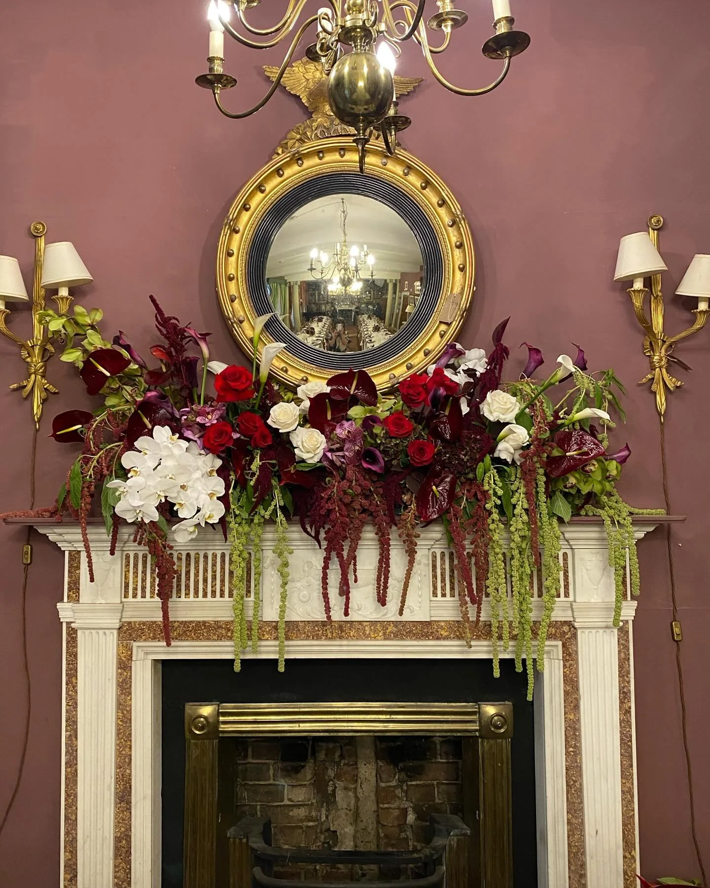 Draping and drama, all in a day&rsquo;s work for the Hanging Amaranthus. Mantle arrangement for the gorgeous @anyaspencerpeet and David ❤️ #clareloveblooms #loveblooms #nofloralfoam