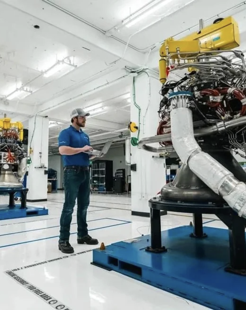 Travis Davis with Blue Origin engine