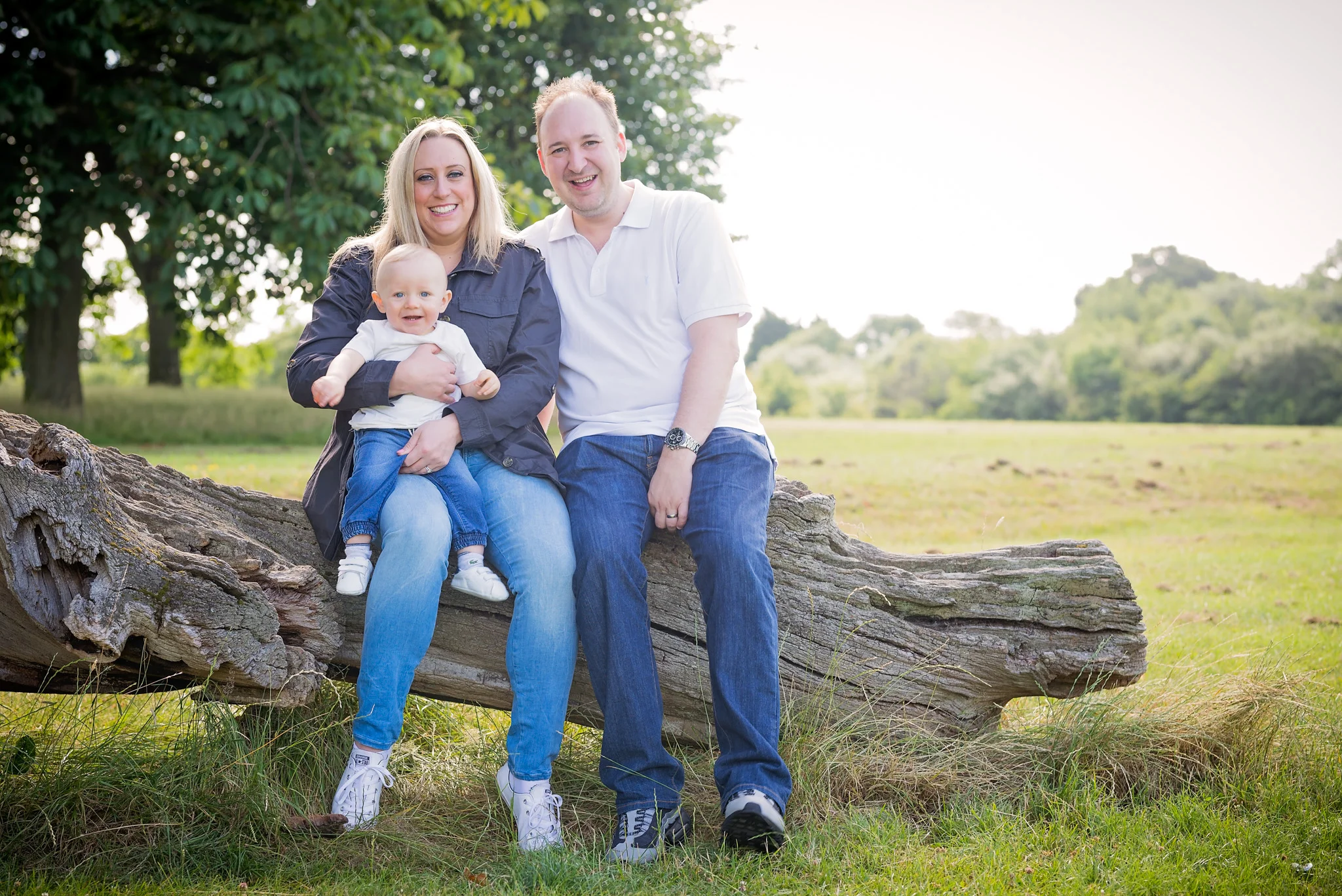 Family portrait on a fallen log | Warwickshire Family Photographer