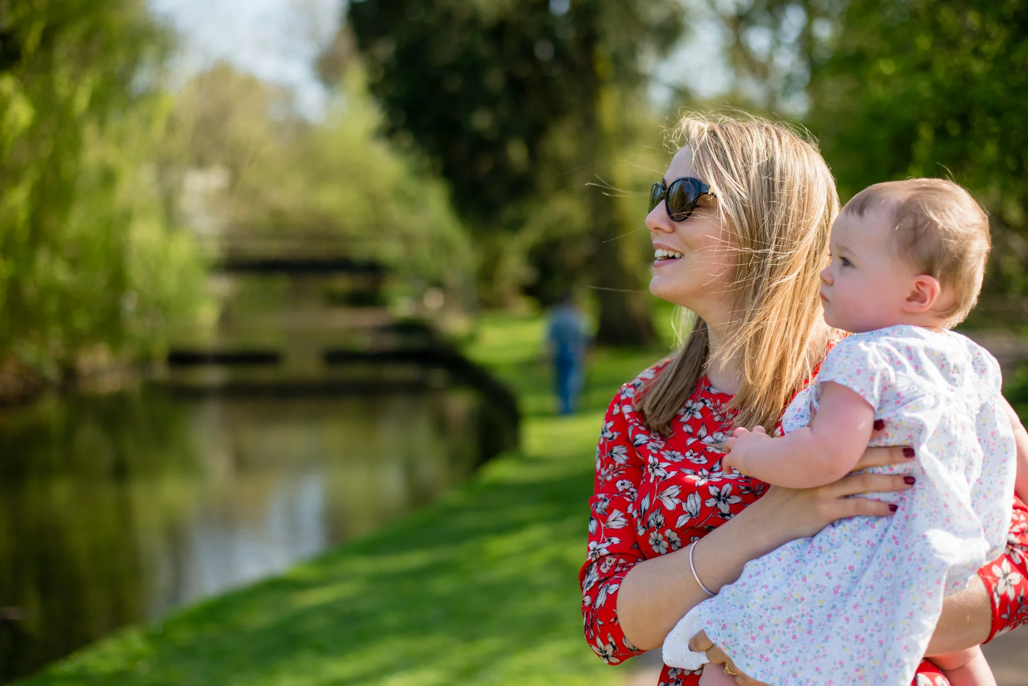 Mum holding baby in the park | Family Photography