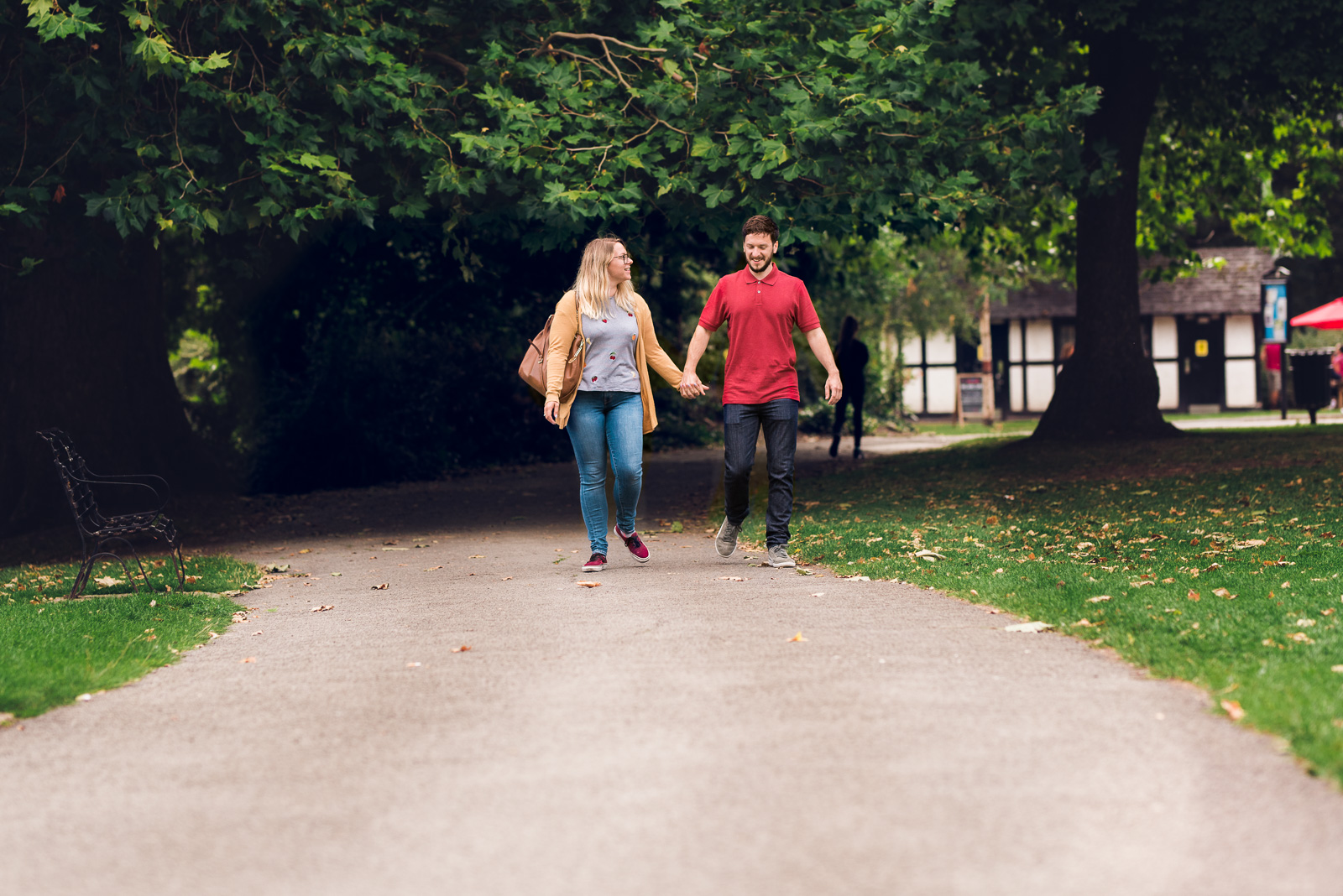 Engaged couple strolling in the park - Cotswolds Wedding Photographer