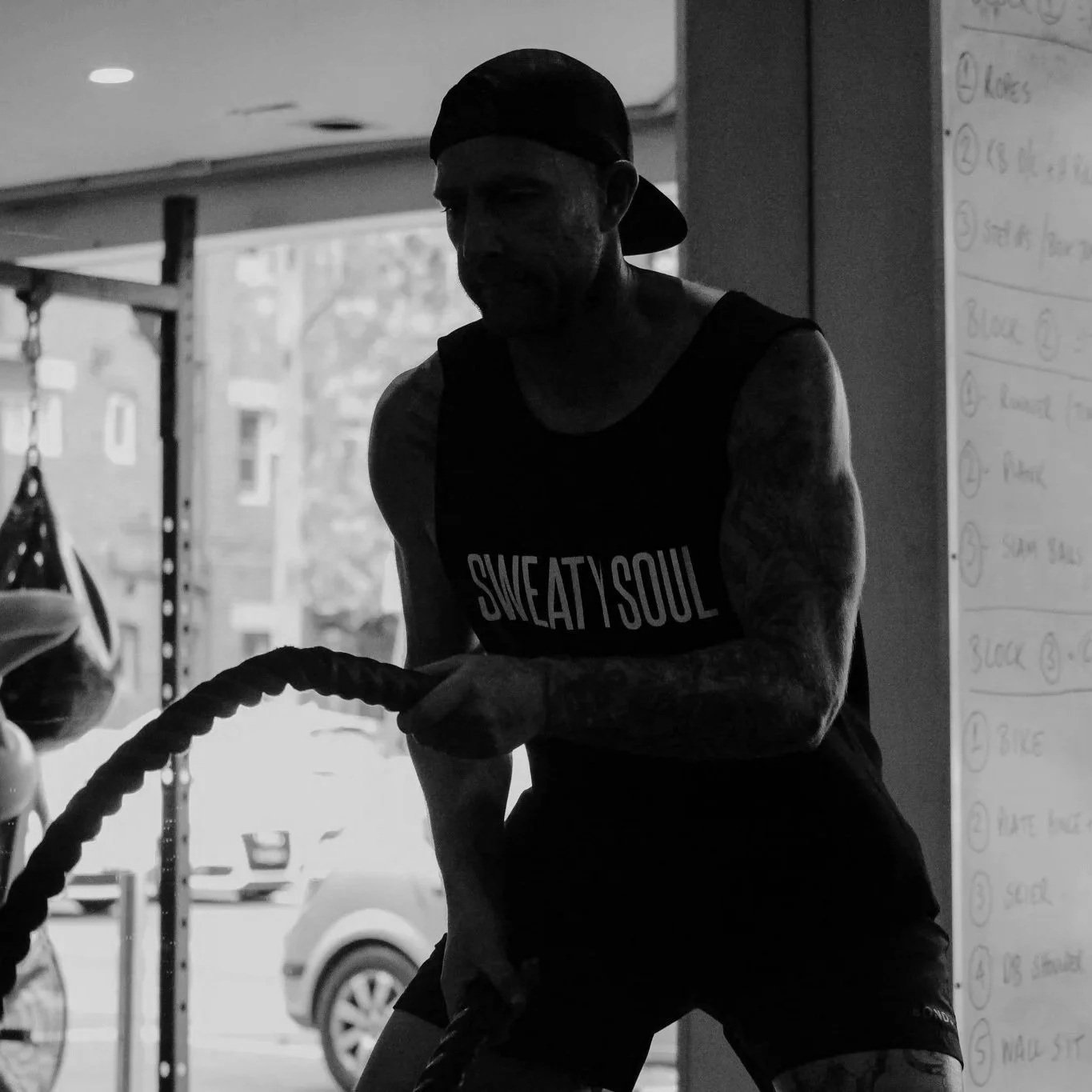 Man using battle ropes during a workout at a community gym in Edgecliff, near Paddington in Sydney’s Eastern Suburbs.