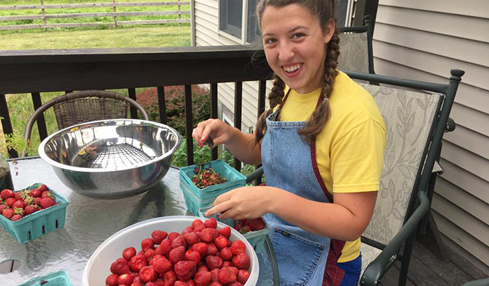 Destiny cleaning organically grown local strawberries
