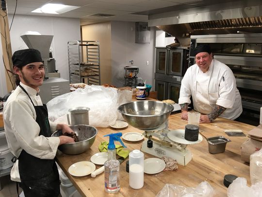 Bakers Caiden Carter, left, and Bob McCullock work on tomorrow's loaves in the Cornerstone's dramatically expanded bakery kitchen. The pair hold two of the 26 new jobs created when the cafe moved to its larger location. (Photo: Dave Tomlin/Ruidoso News)