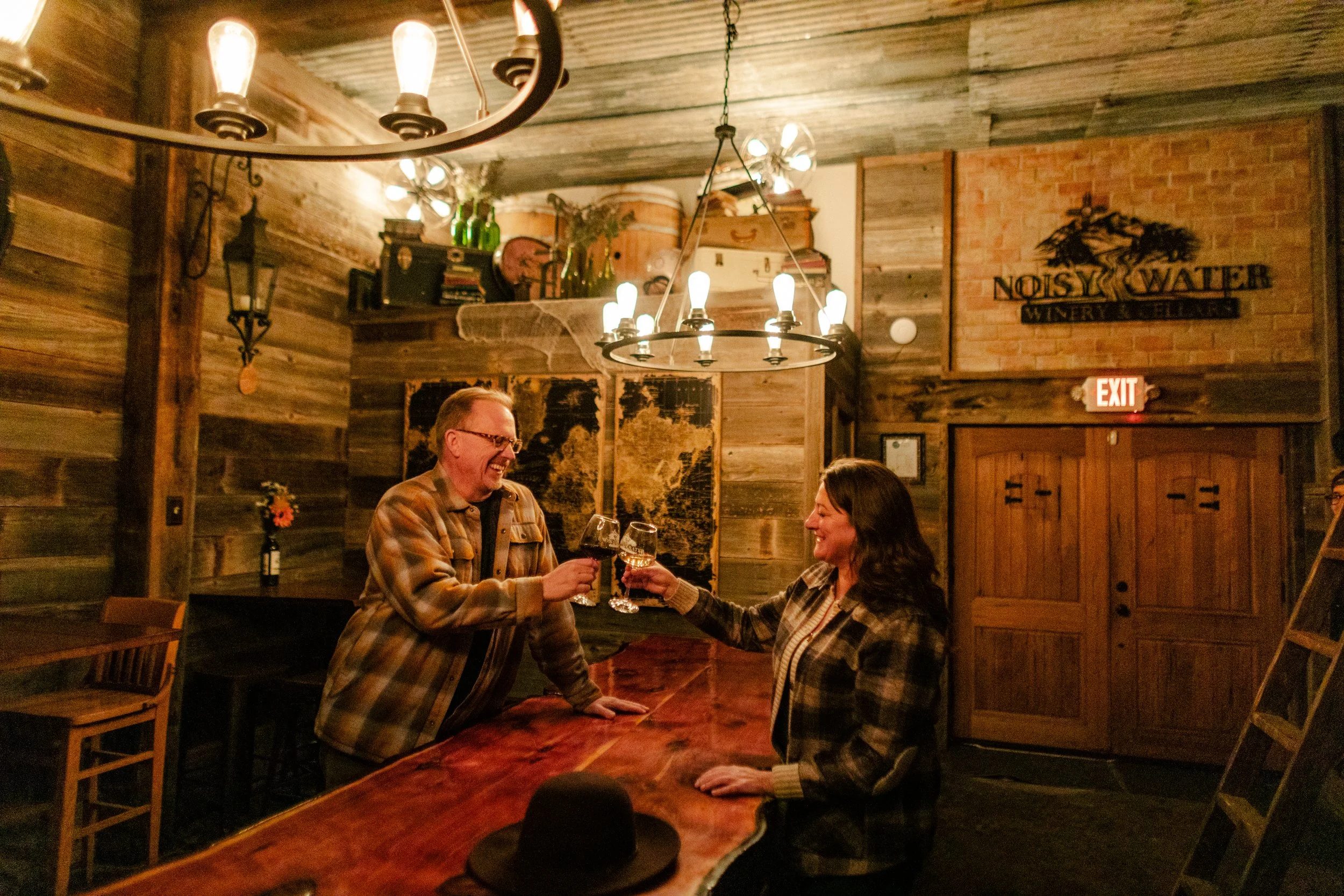 Couple enjoying wine tasting at Noisy Water Winery in Ruidoso.