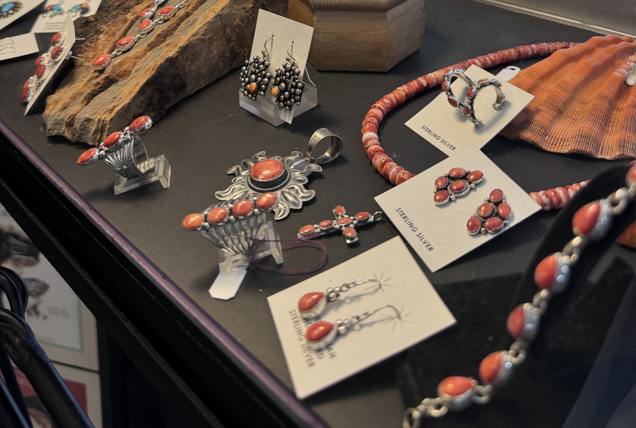 Authentic Native American sterling silver jewelry displayed at Apache Trading Company.