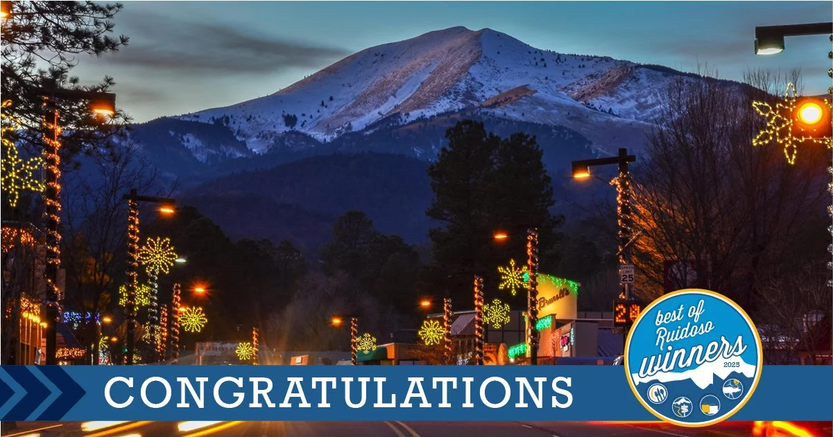 Promotional graphic of Midtown Ruidoso with holiday lights and a snow covered Sierra Blanca peak in the distance. Congratulations banner for the 2025 Best of Ruidoso award winners.Ruidoso, NM