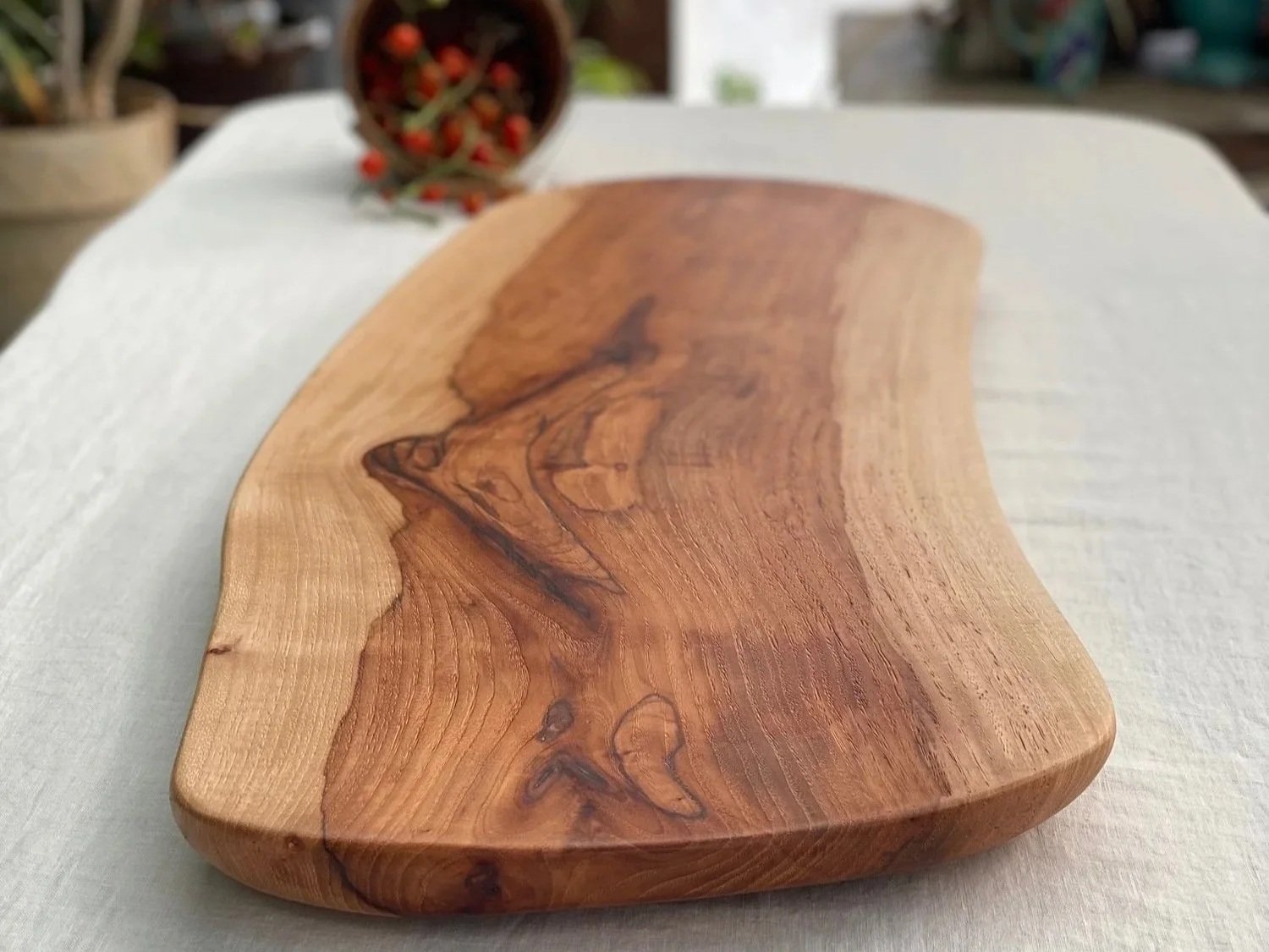 Handcrafted live-edge wooden serving board by Woodswan in Ruidoso.