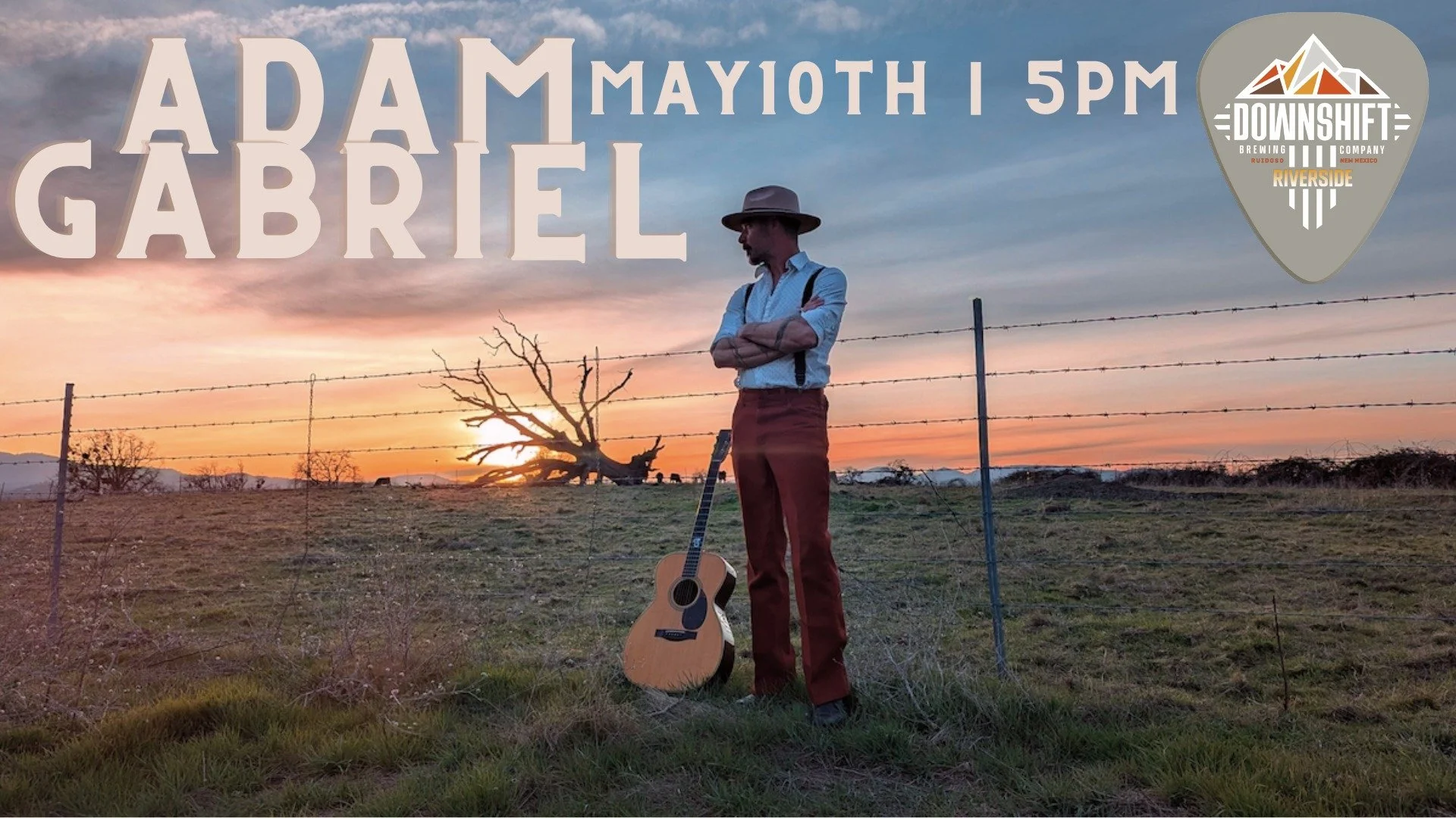 Promotional graphic for Adam Gabriel performing live at Downshift Brewing Co. - Riverside on May 10 at 5 PM, featuring a musician with a guitar in a sunset field.