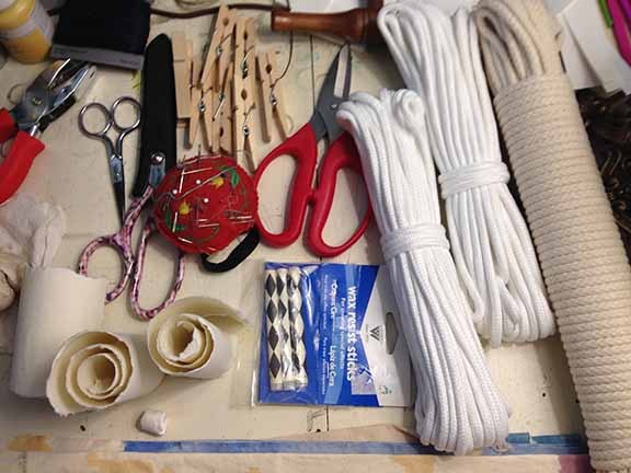 Various types of threads, strings, ropes, scissors, etc. to create enchanting fabrics.