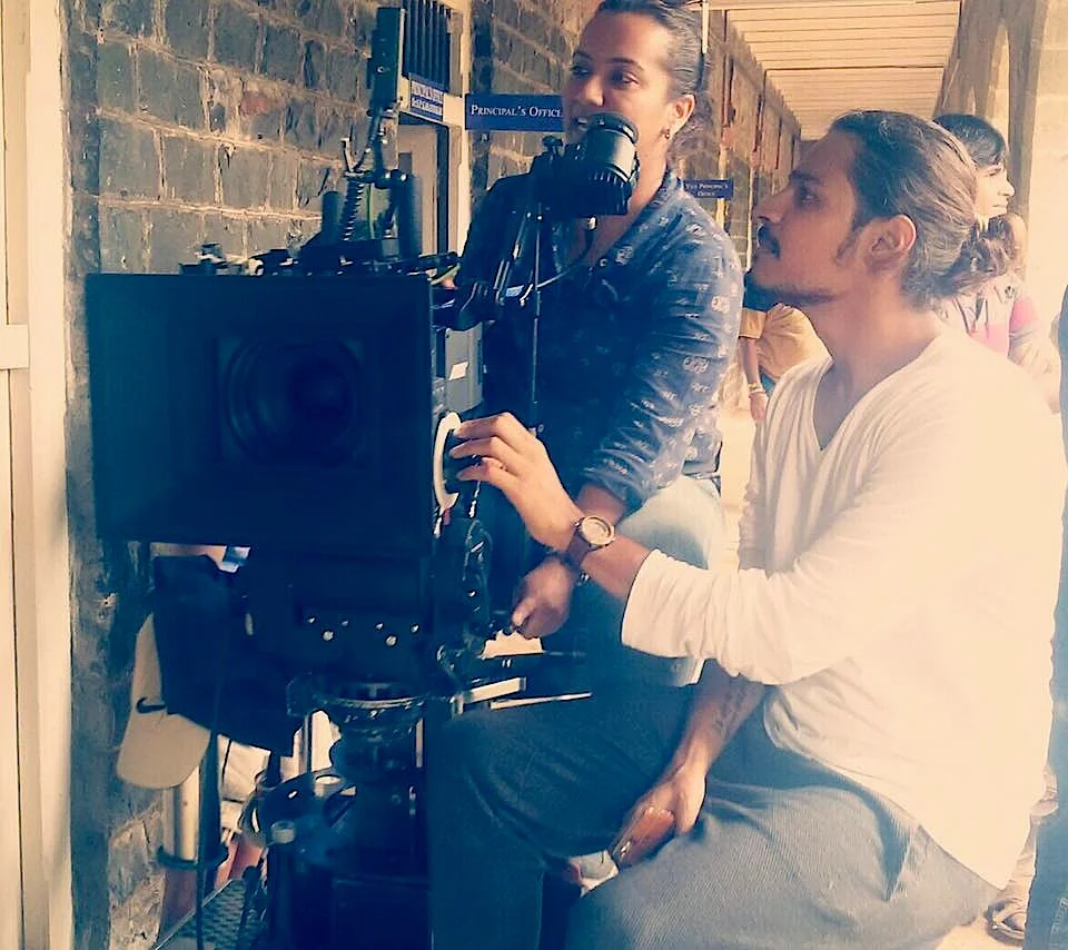Director Sujay Dahake, playfully poses as focus puller on sets of Phuntroo