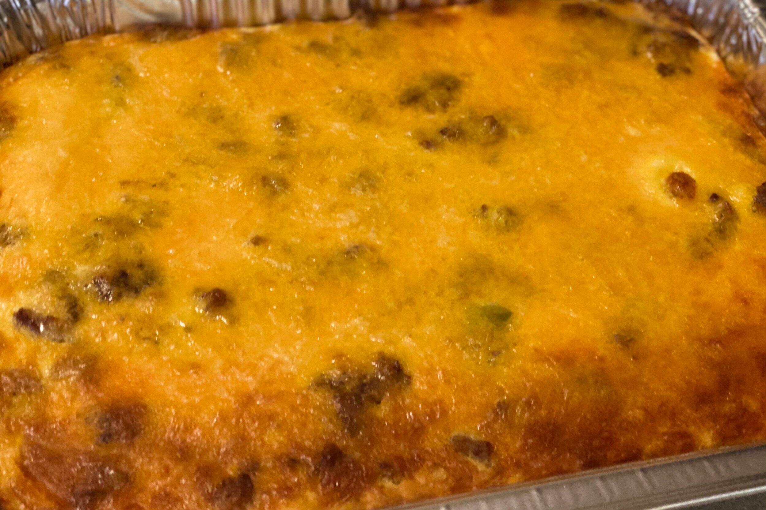  Breakfast casserole with pork sausage, potatoes, diced peppers and onions and cheese 