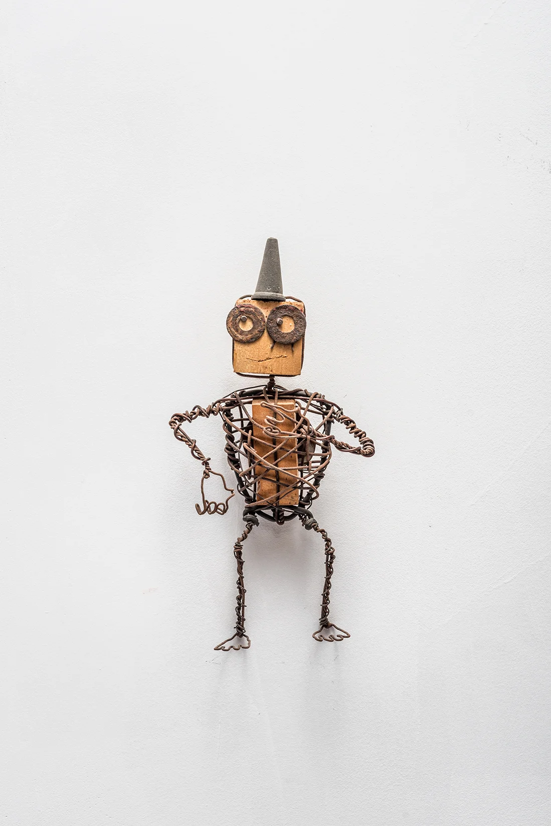 From the Outcasts series,manually bent wire, 42 x 25 x 12 cm, metal wire, wood and found objects, 2004 Photo: Lior Horesh